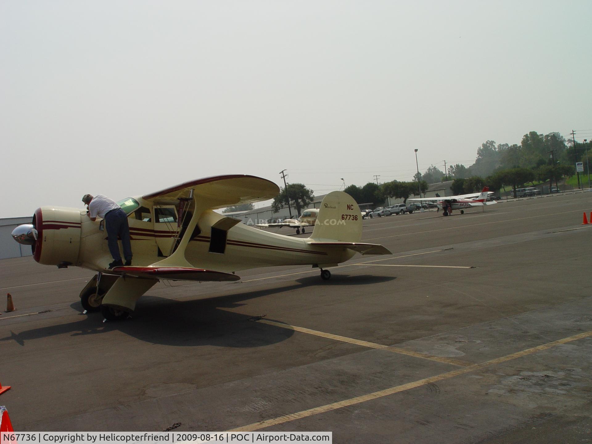 N67736, 1943 Beech D17S Staggerwing C/N 4848, Checking fuel at Brackett