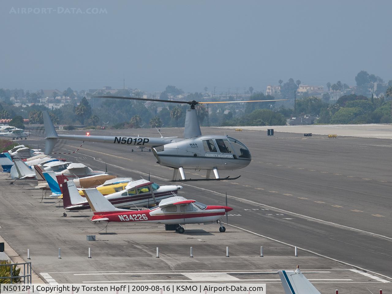 N5012P, 2005 Robinson R44 II C/N 10740, N5012P hovering over the helipad