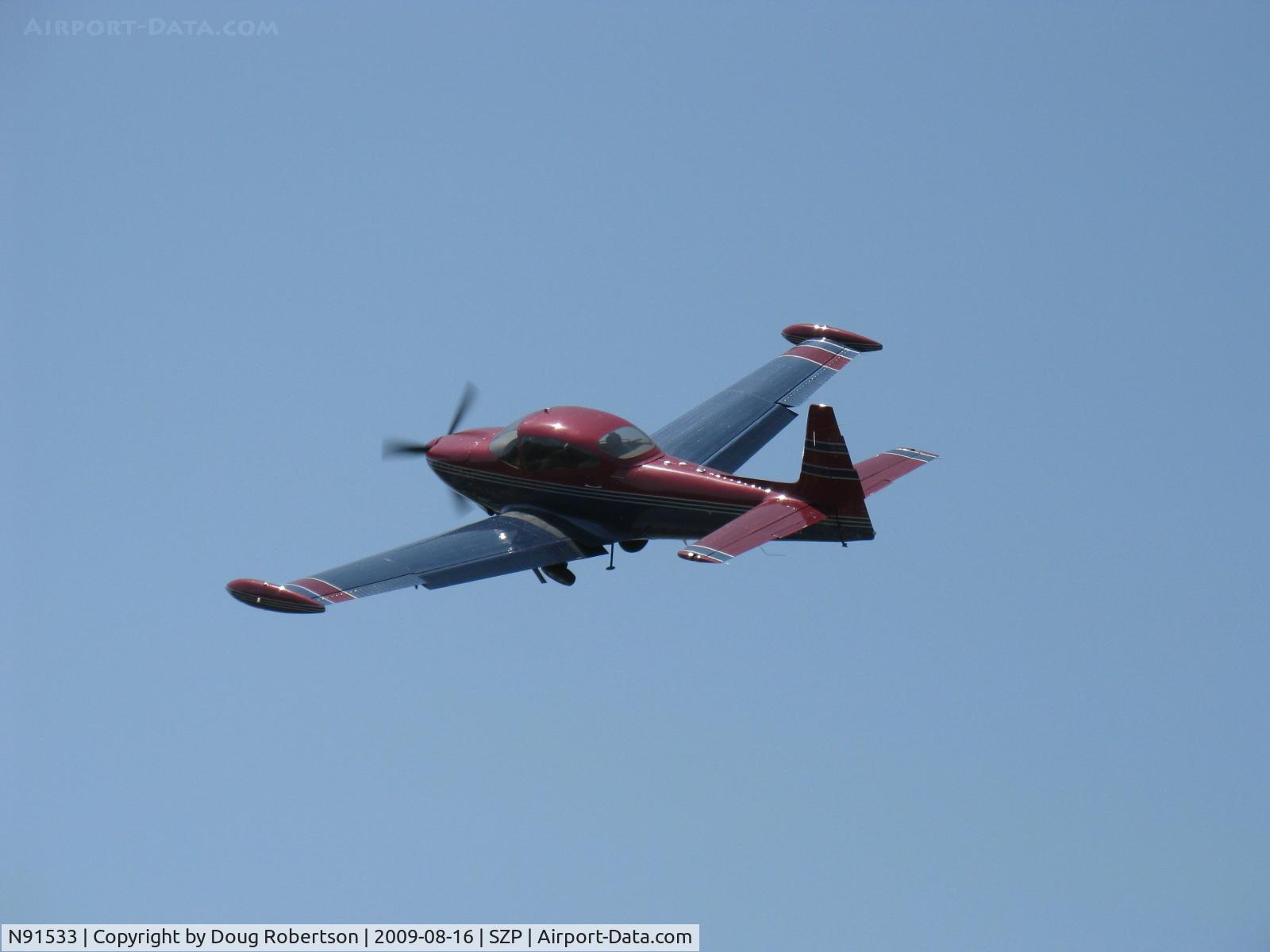 N91533, 1946 North American Navion C/N NAV-4-129, 1946 North American NAVION, Continental E-185-3 185 Hp listed, fast climbing departure turn from Rwy 22. Performance, prop and cowl mods suggest higher horsepower engine upgrade. See prior photo taken 3 seconds earlier.