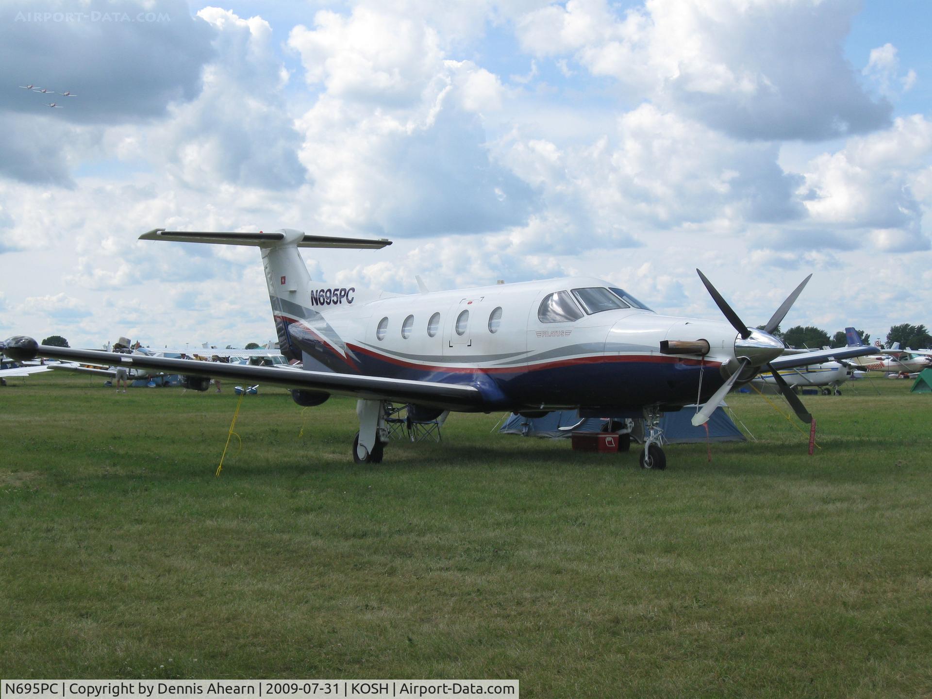 N695PC, 1999 Pilatus PC-12/45 C/N 305, OSH-2009 North 40 parking