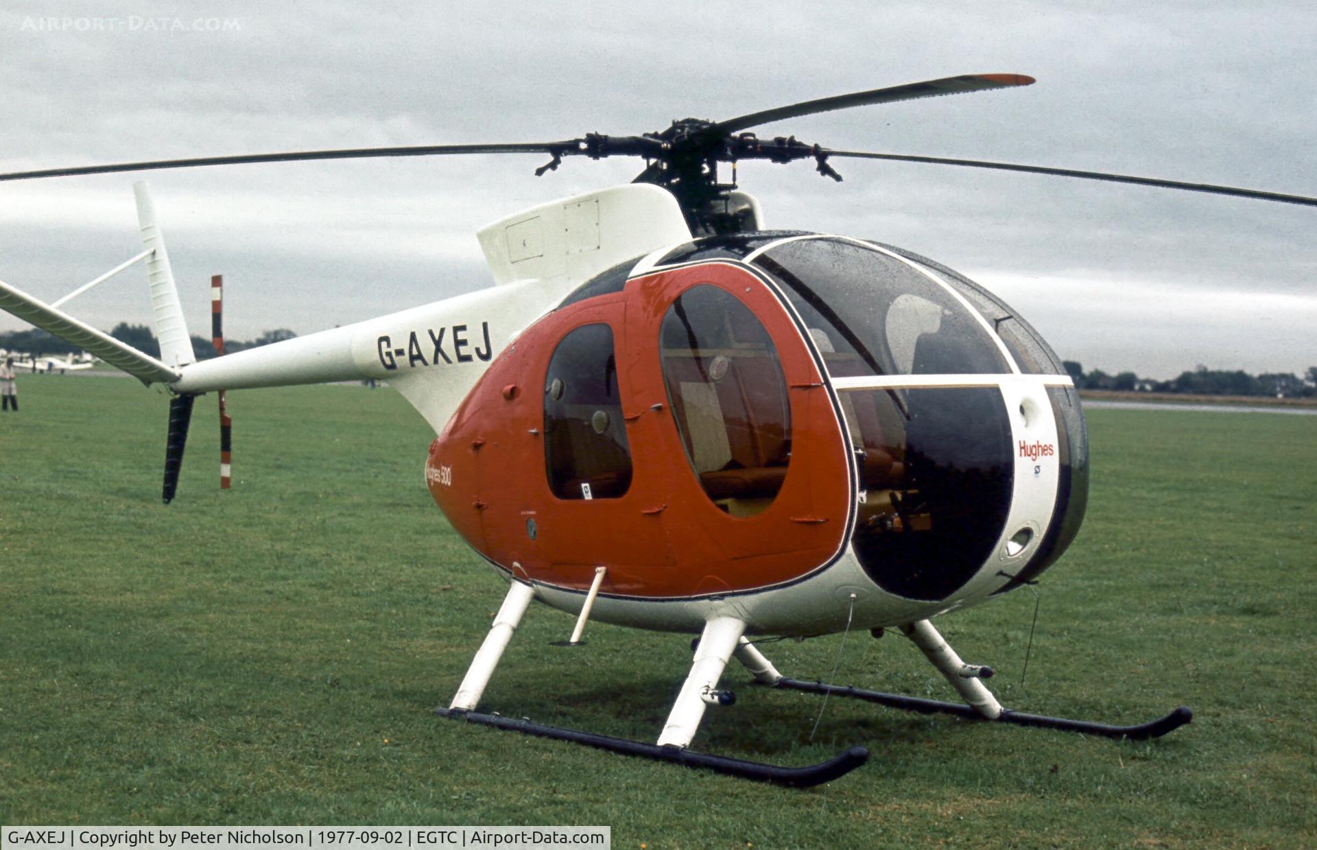 G-AXEJ, 1969 Hughes 369HS C/N 690101S, This Hughes 369HS was at the 1977 Cranfield Business & Light Aviation Show.