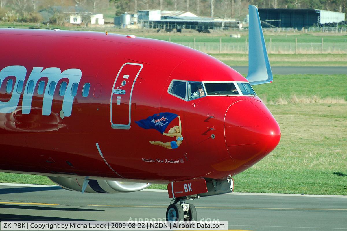 ZK-PBK, 2008 Boeing 737-8FE C/N 36604, Great reflection of the engine. And the FO is making an announcement...