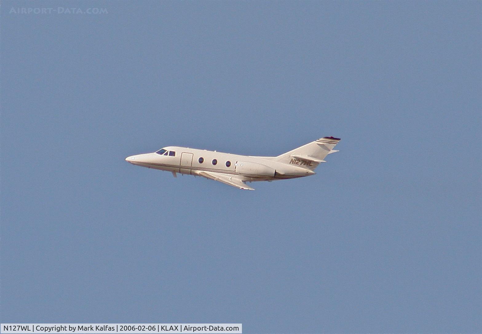 N127WL, 1974 Dassault Falcon 10 C/N 16, FALCON 10, N127WL departing 24L KLAX turning south along the coast.