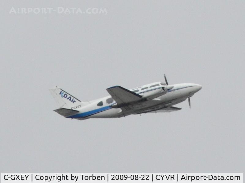 C-GXEY, 1973 Piper PA-31-350 Chieftain C/N 31-7305044, KD air Piper PA-31-350, after take-off from southern runway, heading northeast from Vancouver International (CYVR).