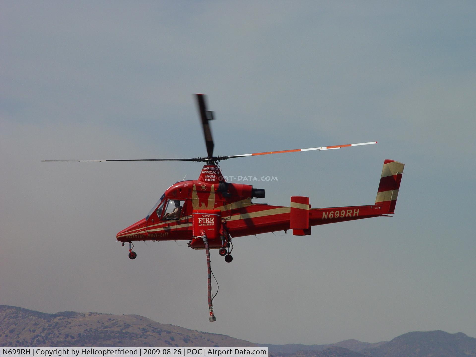 N699RH, 1994 Kaman K-1200 K-Max C/N A94-0019, Airbourne taxi to westside heliport per Brackett Tower's request due to large helicopters in bound and outbound on the eastside