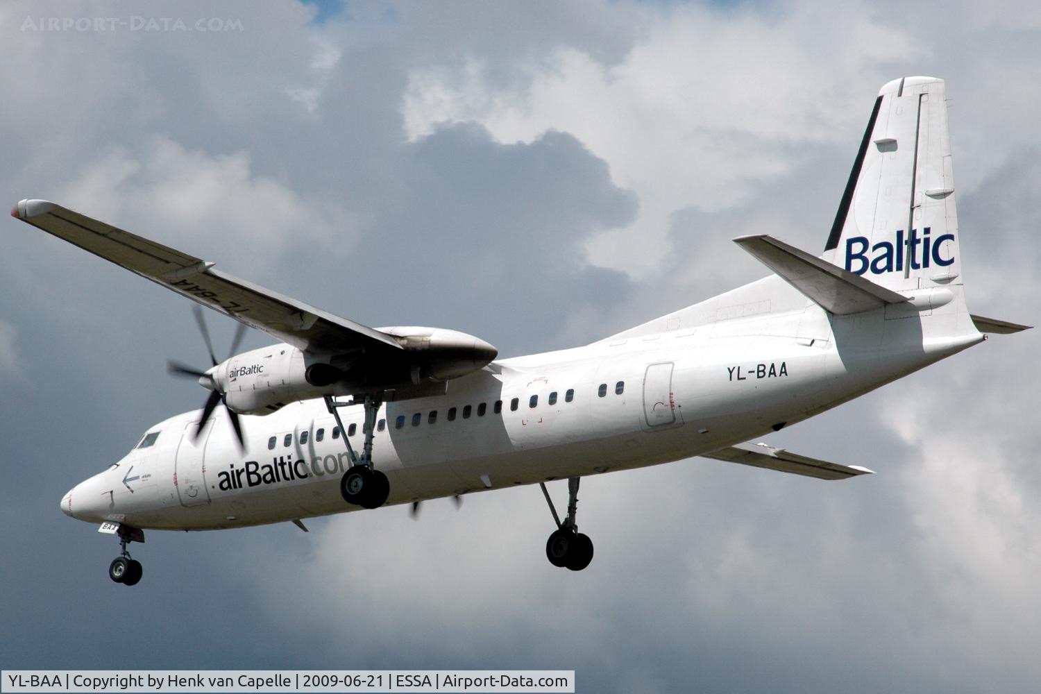 YL-BAA, 1988 Fokker 50 C/N 20120, An Air Baltic Fokker 50 about to land at Stockholm Arlanda. Note the bad paintwork.