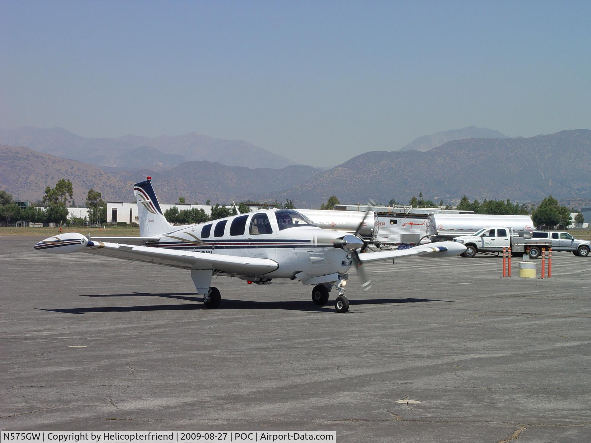 N575GW, 2001 Raytheon Aircraft Company A36 Bonanza C/N E-3390, Taxiing through the maze of Fire Birds and equipment enroute to Howard Aviation