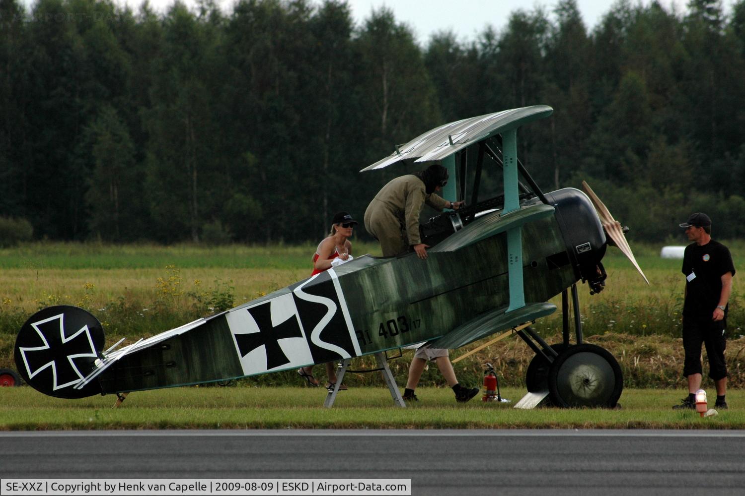 SE-XXZ, 2008 Fokker Dr.1 Triplane Replica C/N 1306, Builder and pilot Mikael Carlson getting into his replica Fokker Dr.1 (using the kitchen-stairs).