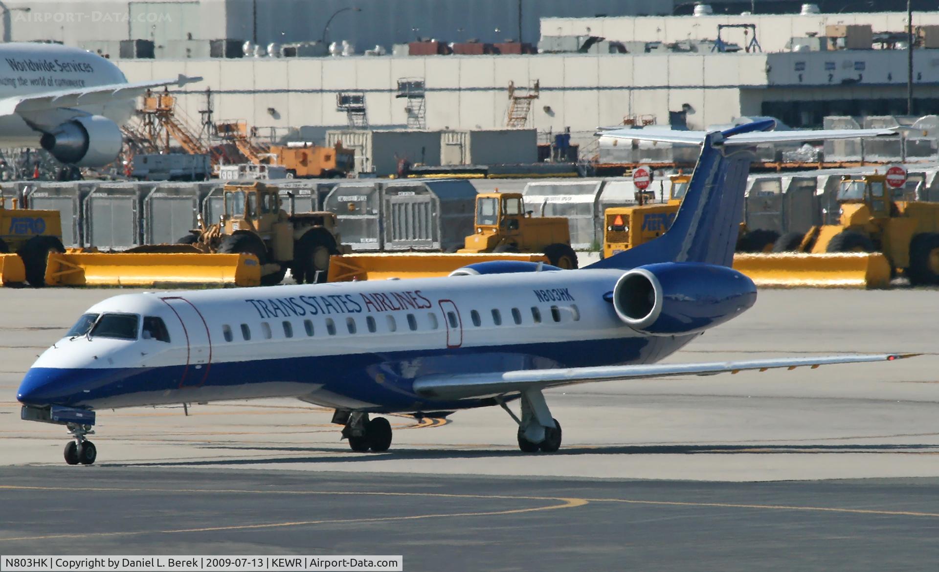 N803HK, 1998 Embraer EMB-145EP (ERJ-145EP) C/N 145077, A colorful Brazilian regional jet shimmers in the summer heat at Newark.