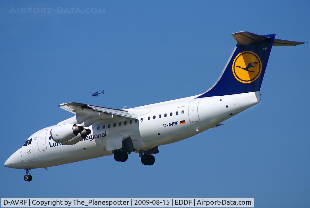 D-AVRF, 1995 British Aerospace Avro 146-RJ85 C/N E.2269, Racing a Helicopter over his left Wing.