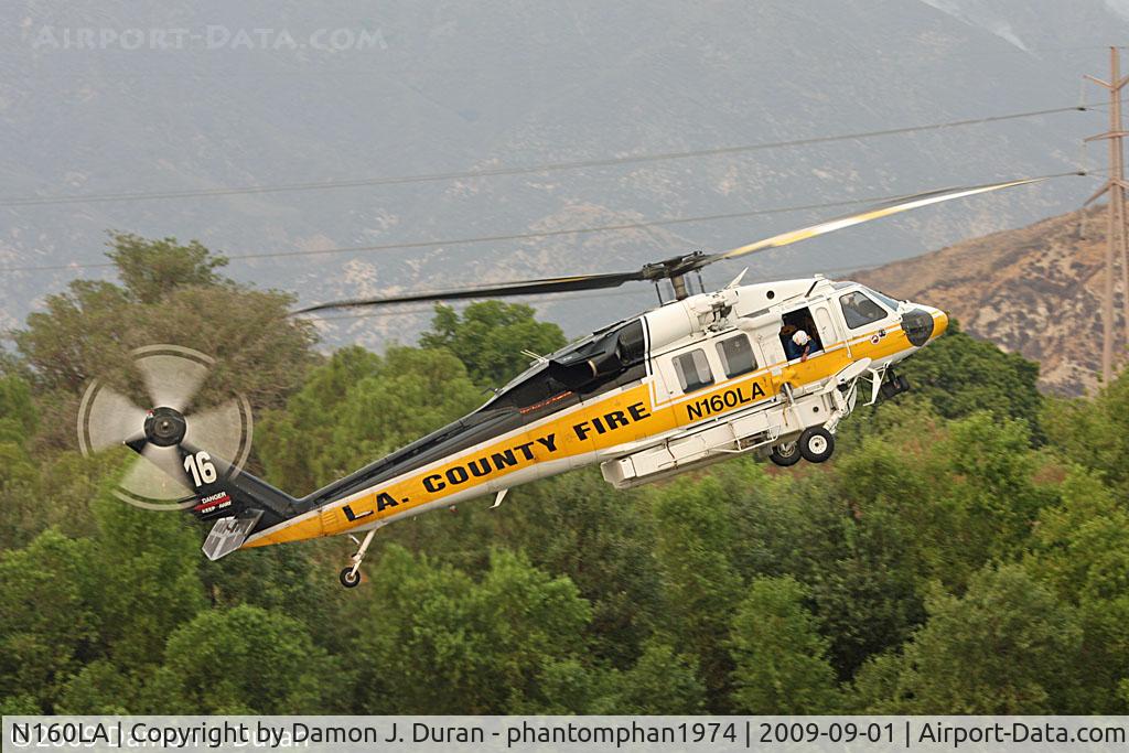 N160LA, 2000 Sikorsky S-70A Firehawk C/N 702453, Hovering to set up to get water for Station Fire in Los Angeles, CA area.