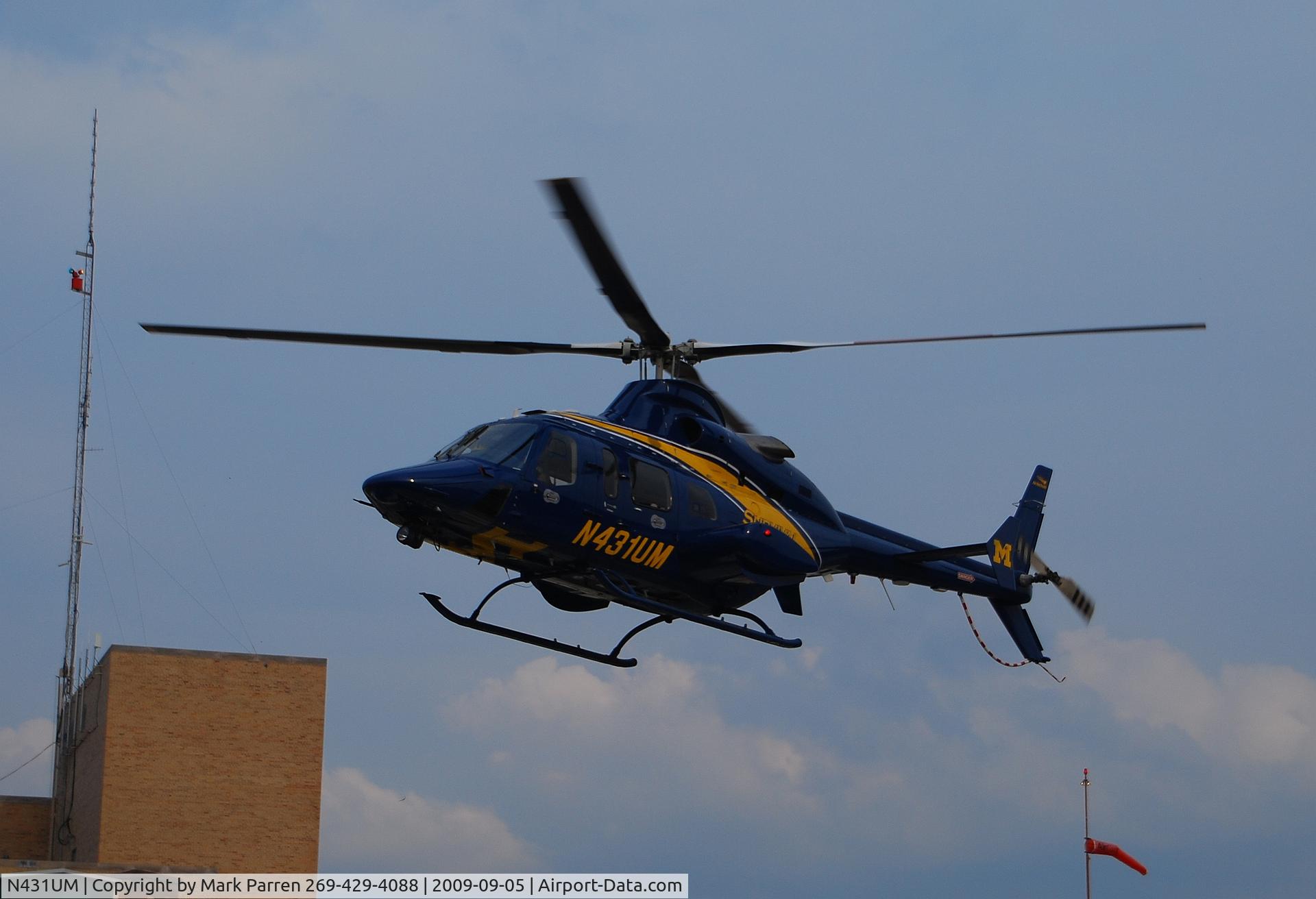 N431UM, Bell 430 C/N 49040, Leaving Lakeland Saint Joseph Hospital, St. Joseph, Michigan