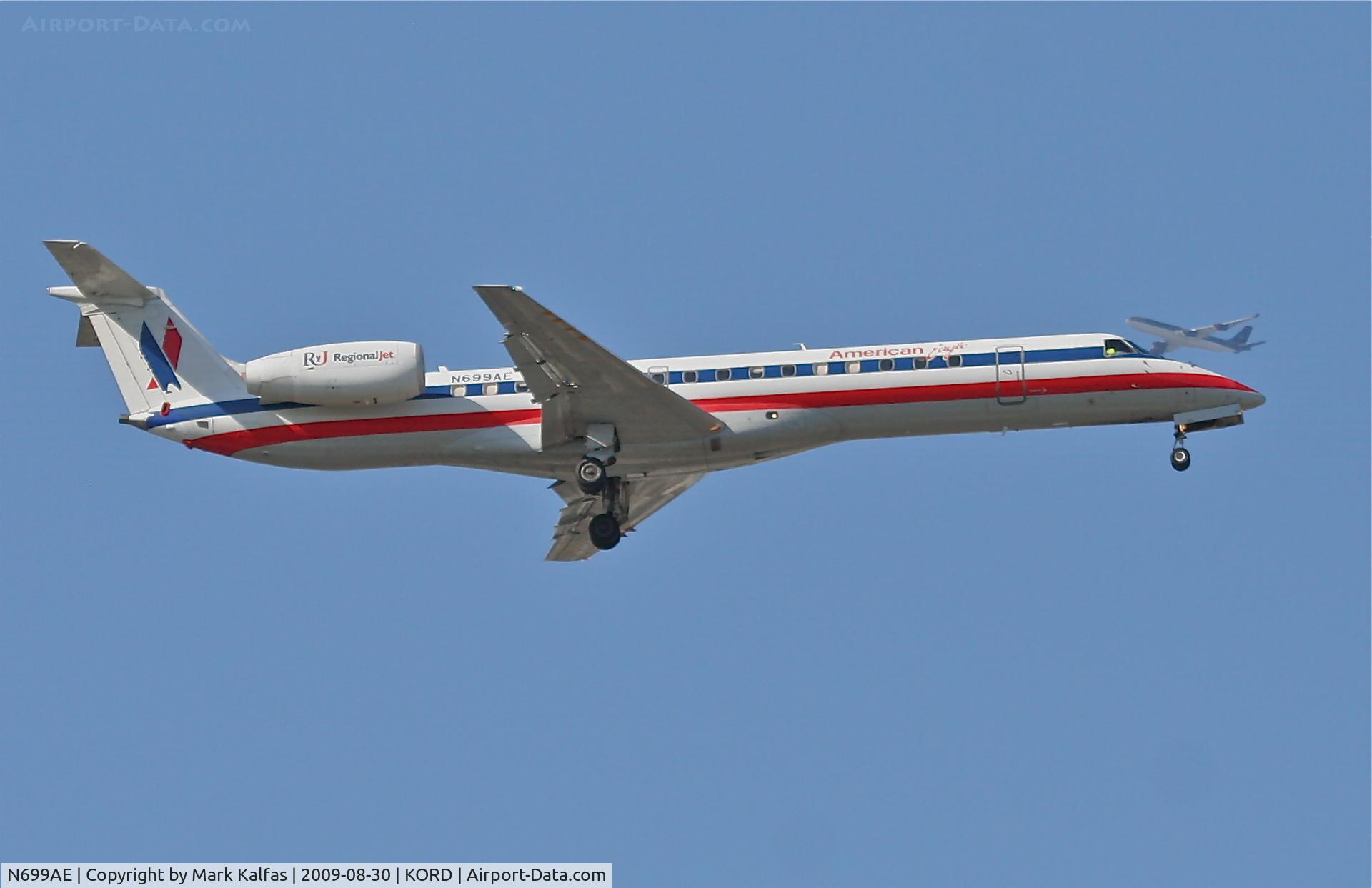 N699AE, 2005 Embraer ERJ-145LR (EMB-145LR) C/N 14500883, American Eagle EMB-145LR, N699AE on final RWY 10 KORD with a Royal Jordanian A340-200 crossing overhead.