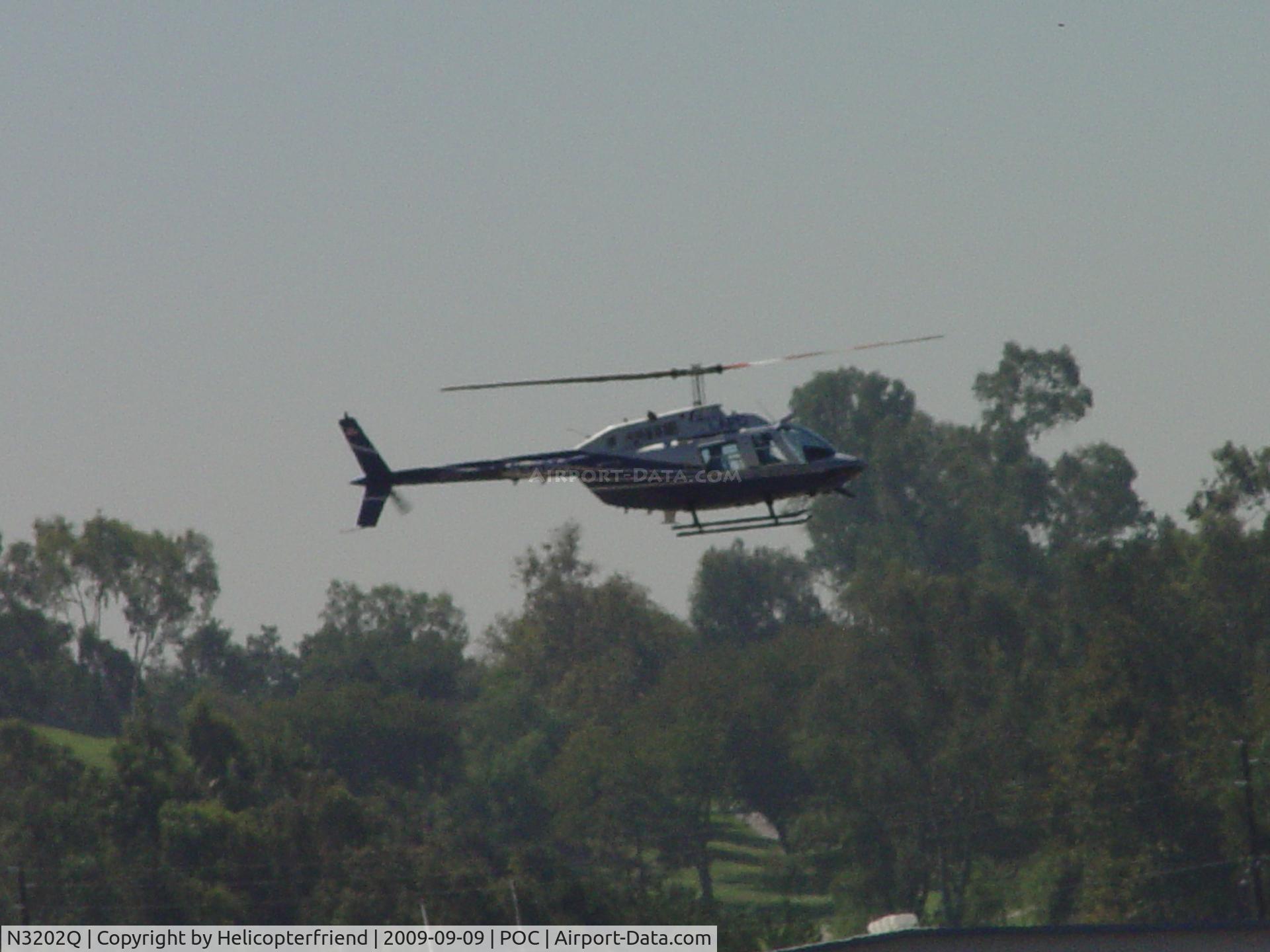 N3202Q, 1986 Bell 206B JetRanger C/N 3938, Taxiing westbound over south taxiway