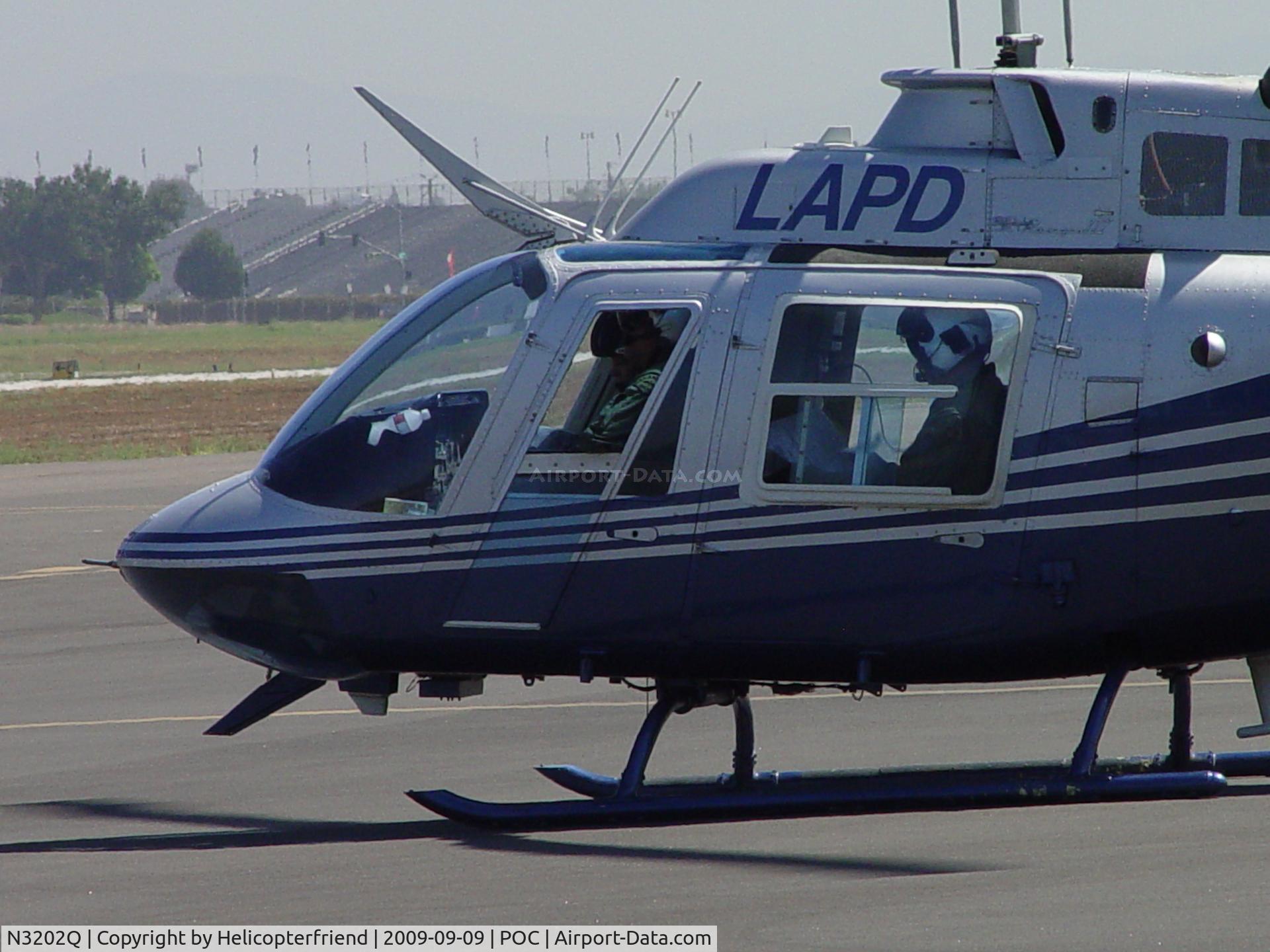 N3202Q, 1986 Bell 206B JetRanger C/N 3938, Appear to be checking maps or aircharts