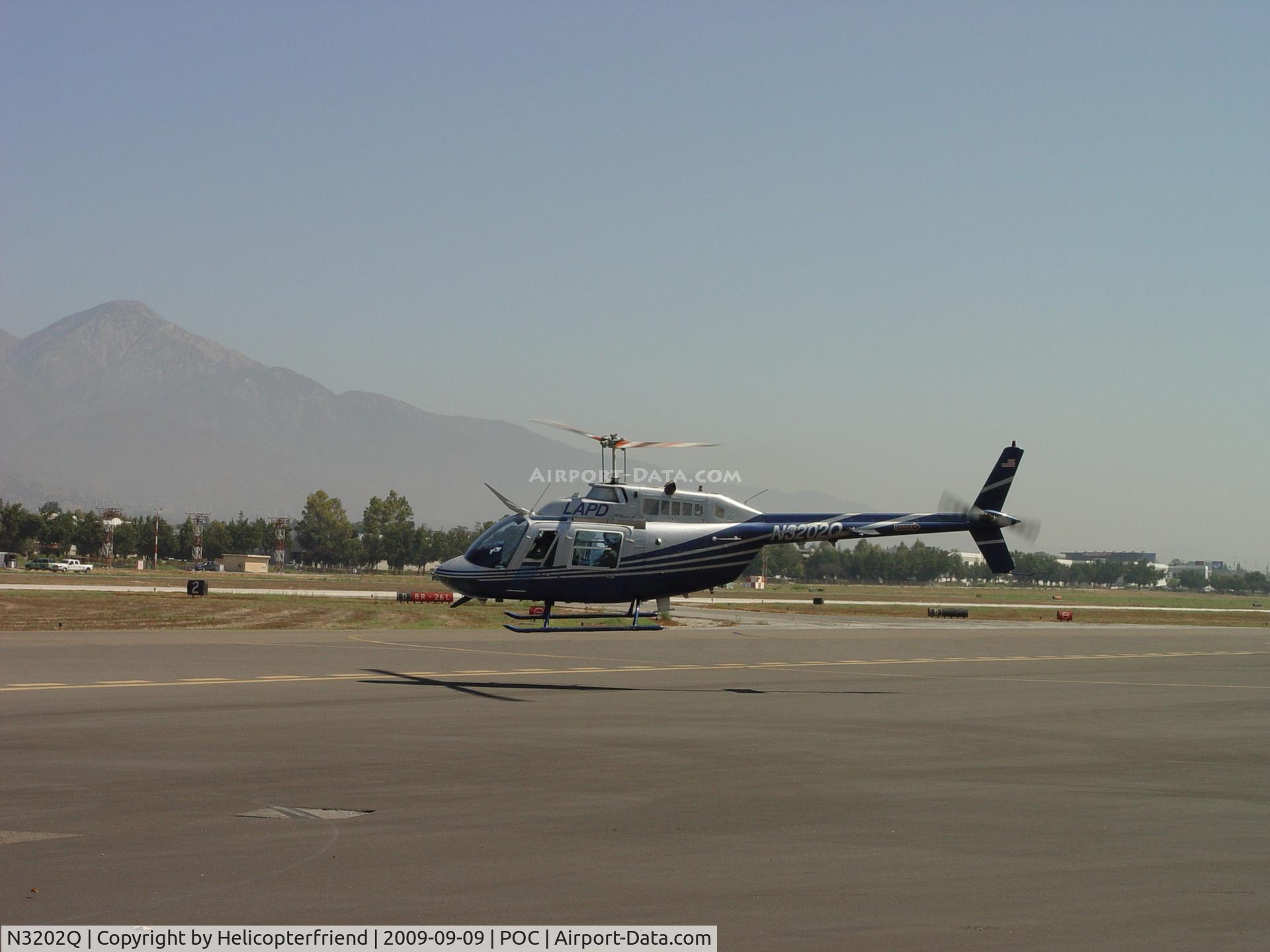 N3202Q, 1986 Bell 206B JetRanger C/N 3938, Departing westbound from south taxiway