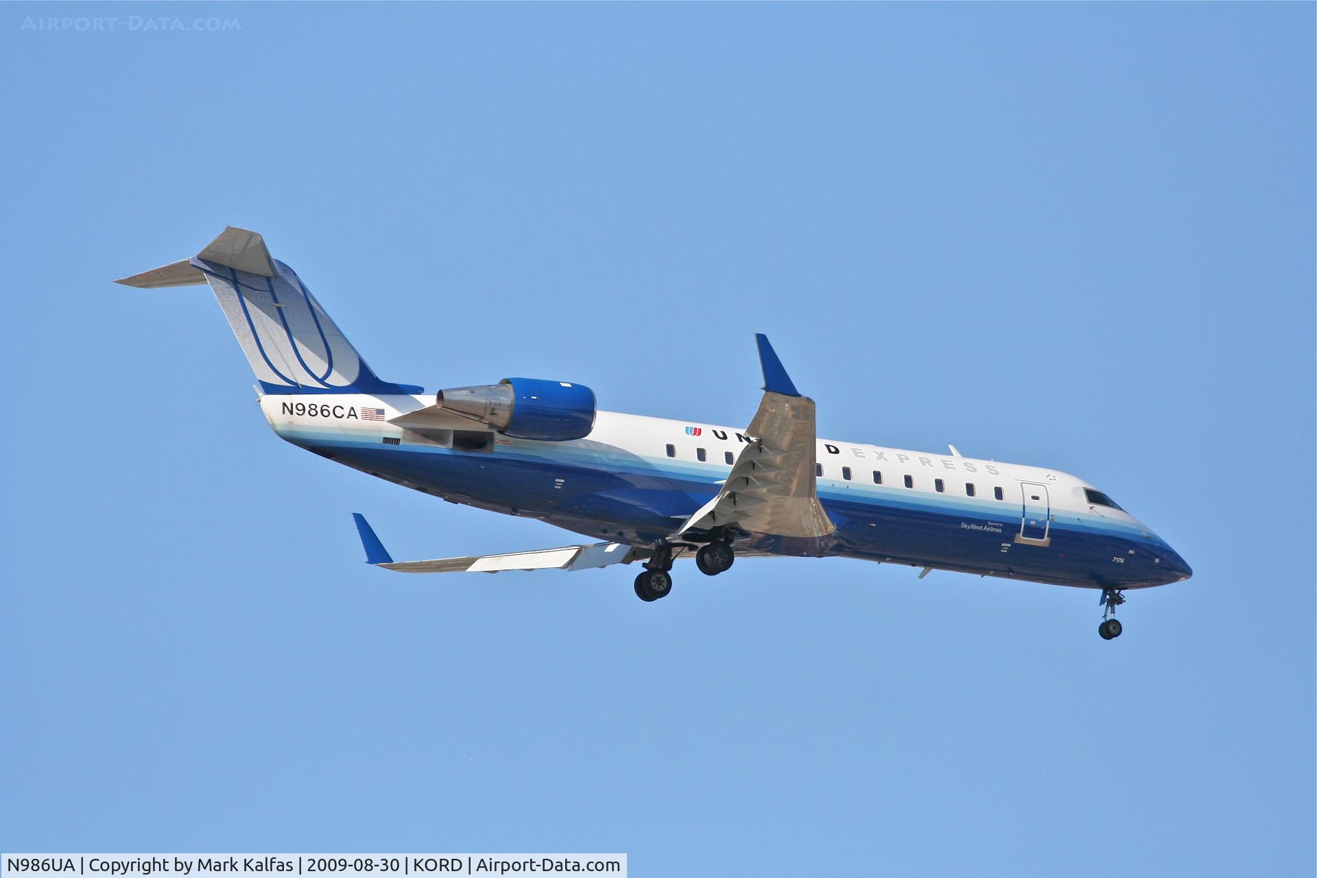 N986UA, 1979 Boeing 737-291 C/N 21748, Sky West/ United Express Bombardier 600-2B19, N986CA on final RWY 10 KORD