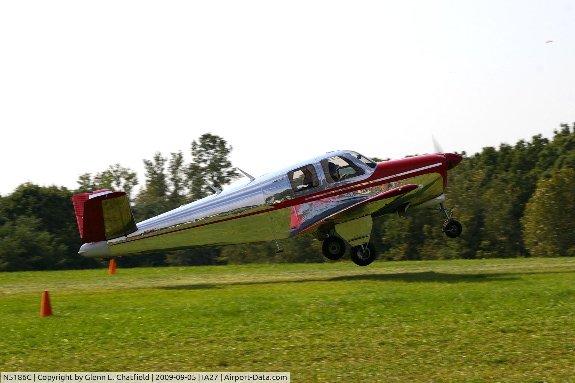 N5186C, 1950 Beech B35 Bonanza C/N D-2468, At the Antique Airplane Association Fly In, just lifting off on departure