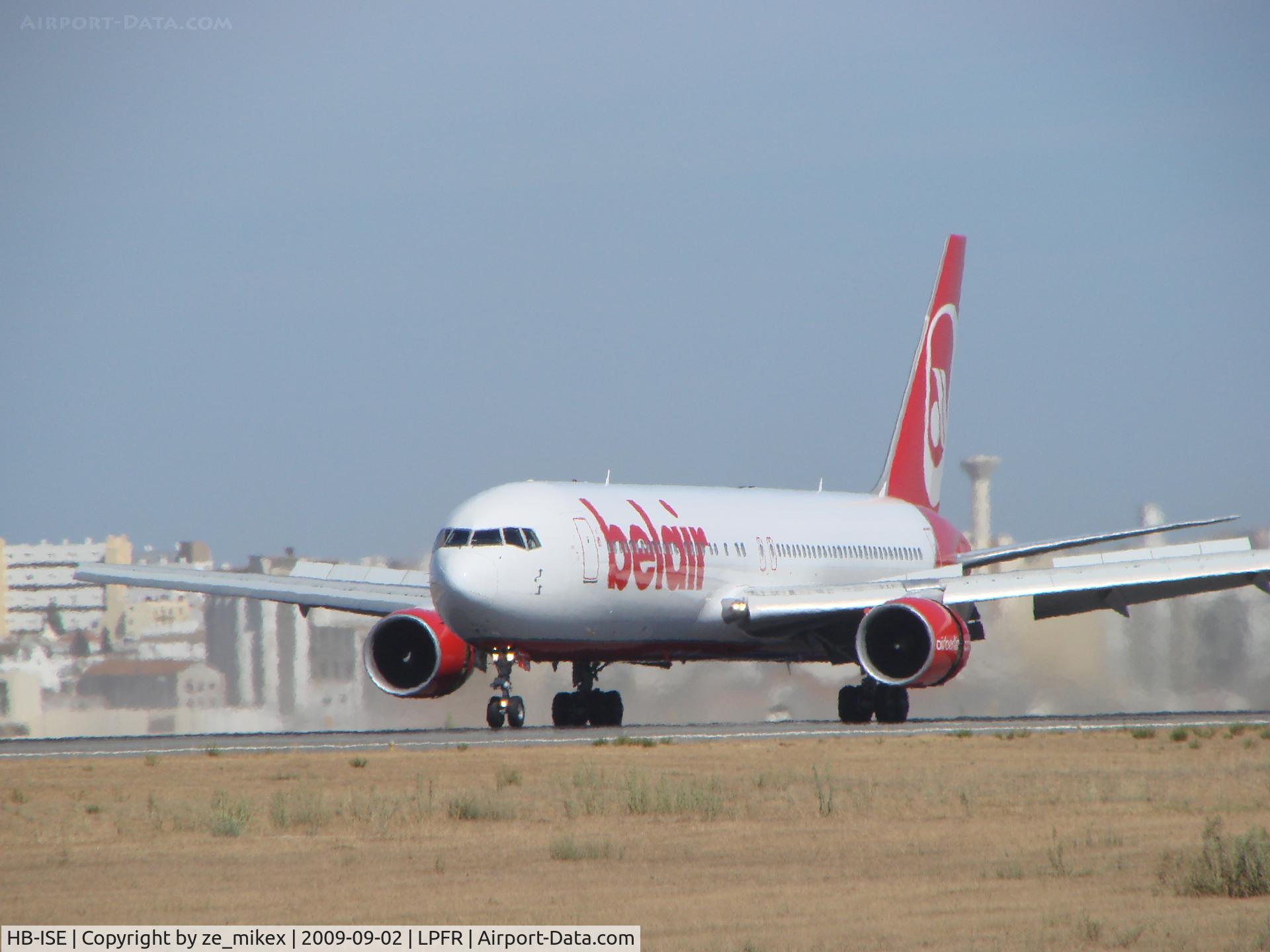 HB-ISE, 1997 Boeing 767-3Q8 C/N 27600, A big plane waited by some spotters in FARO