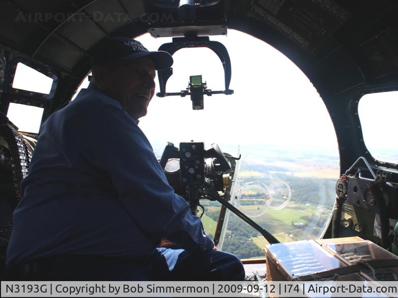 N3193G, 1944 Boeing B-17G Flying Fortress C/N 77255, That's Dad, a WW2 Navy veteran checking out the bombardier's perch at 2500' over western Ohio.
