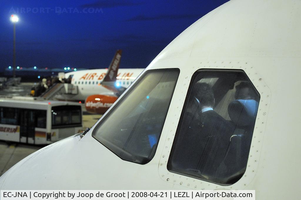 EC-JNA, 2005 Airbus A320-214 C/N 2596, cockpit crew preparing for departure.