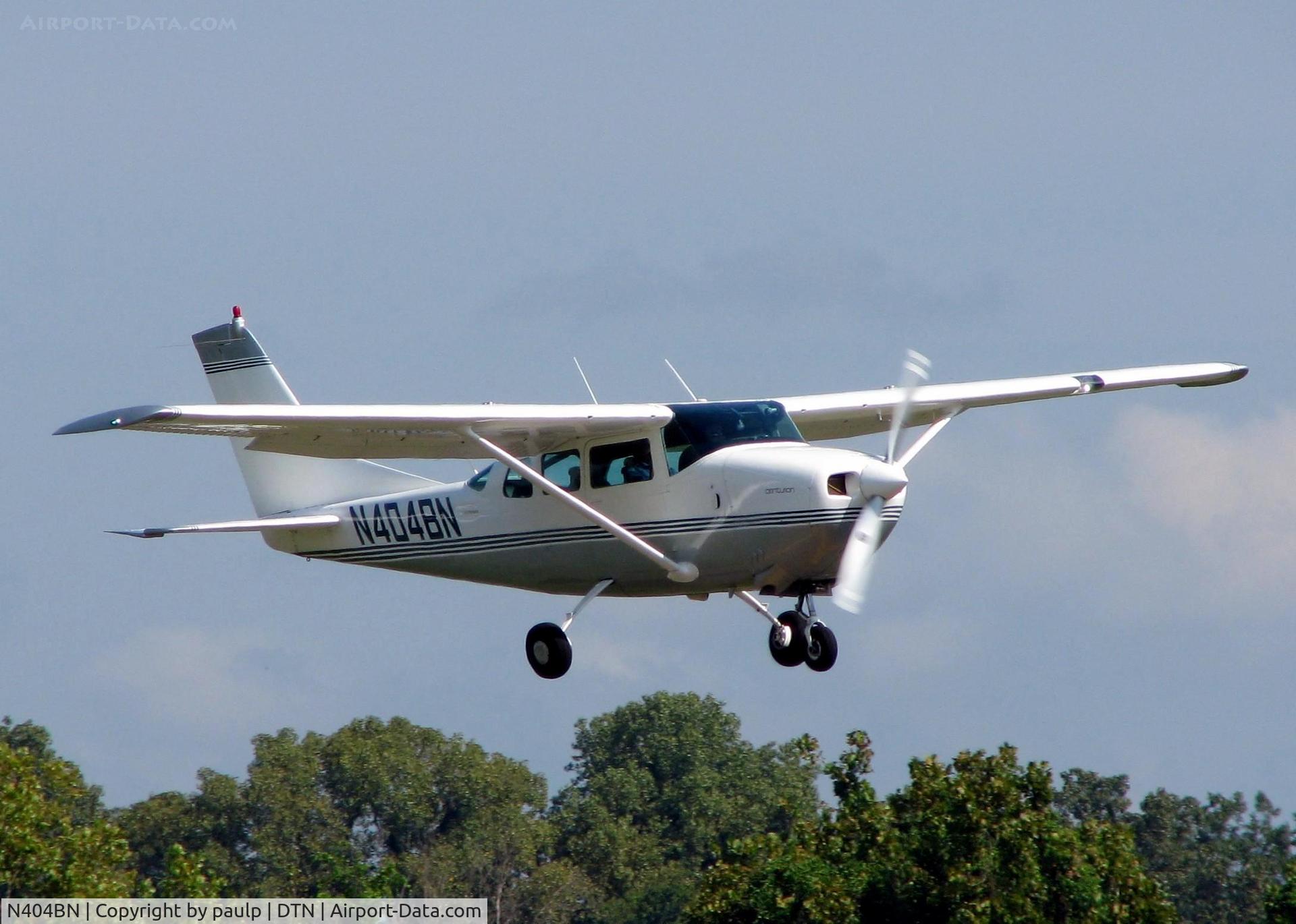 N404BN, 1965 Cessna 210E Centurion C/N 21058705, Landing on 14 at Downtown Shreveport.