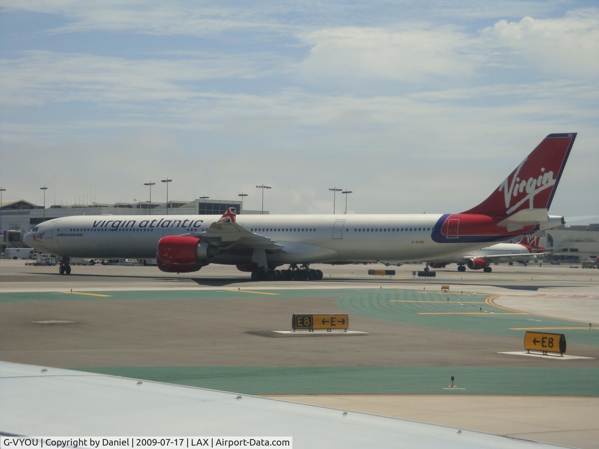 G-VYOU, 2006 Airbus A340-642 C/N 765, Taxing out of the gate.