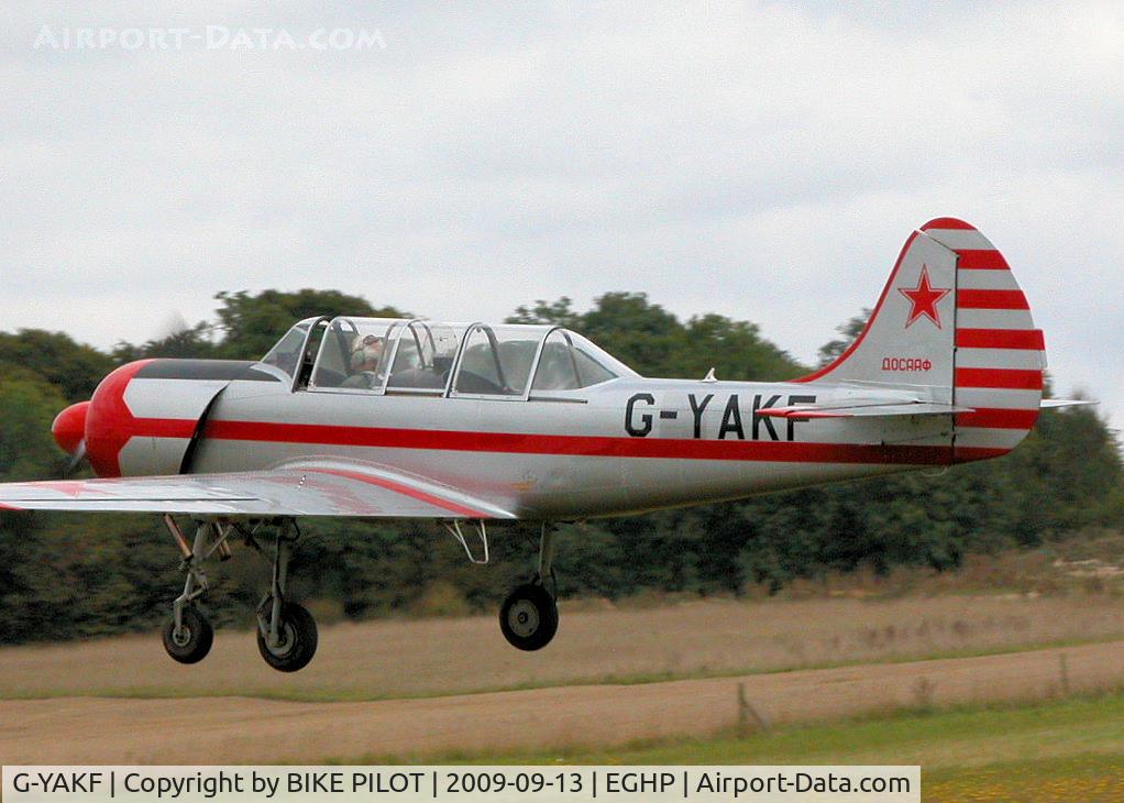 G-YAKF, 1991 Yakovlev (Aerostar) Yak-52 C/N 9111205, DEPARTING VIA RWY 03. PREV. REG. ZU-IAK. POPHAM RUSSIAN AIRCRAFT FLY-IN