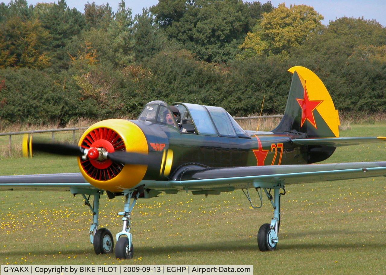 G-YAKX, 1991 Yakovlev (Aerostar) Yak-52 C/N 9111307, RESIDENT YAK-52 TAXYING IN AFTER LOCAL FLIGHT. PREV. REG. RA-44473. POPHAM RUSSIAN AIRCRAFT FLY-IN