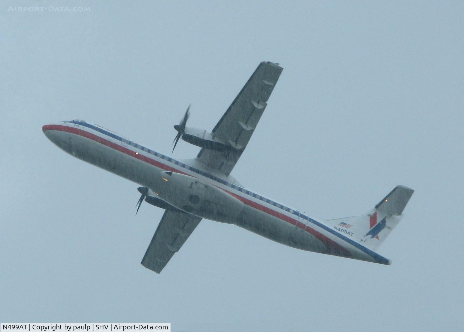 N499AT, 1997 ATR 72-212A C/N 499, Off of runway 5 in the pouring rain. At Shreveport Regional airport.