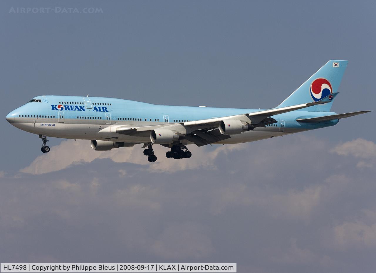 HL7498, 1996 Boeing 747-4B5 C/N 26402, Short final to rwy 24R. Big white dome on the back of the fuselage. Look at that cloud structure on the background.