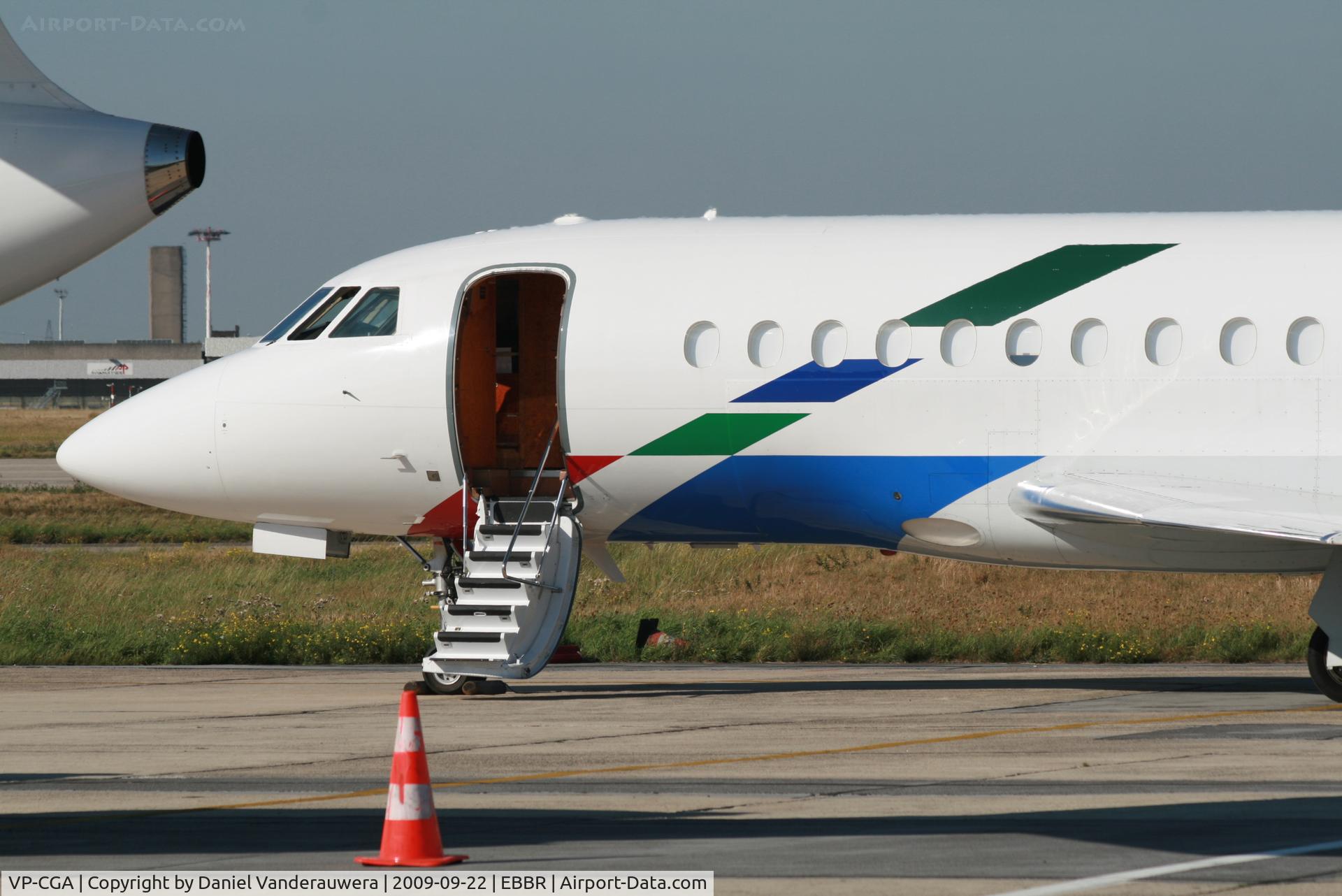 VP-CGA, 1999 Dassault Falcon 2000 C/N 100, parked on General Aviation apron