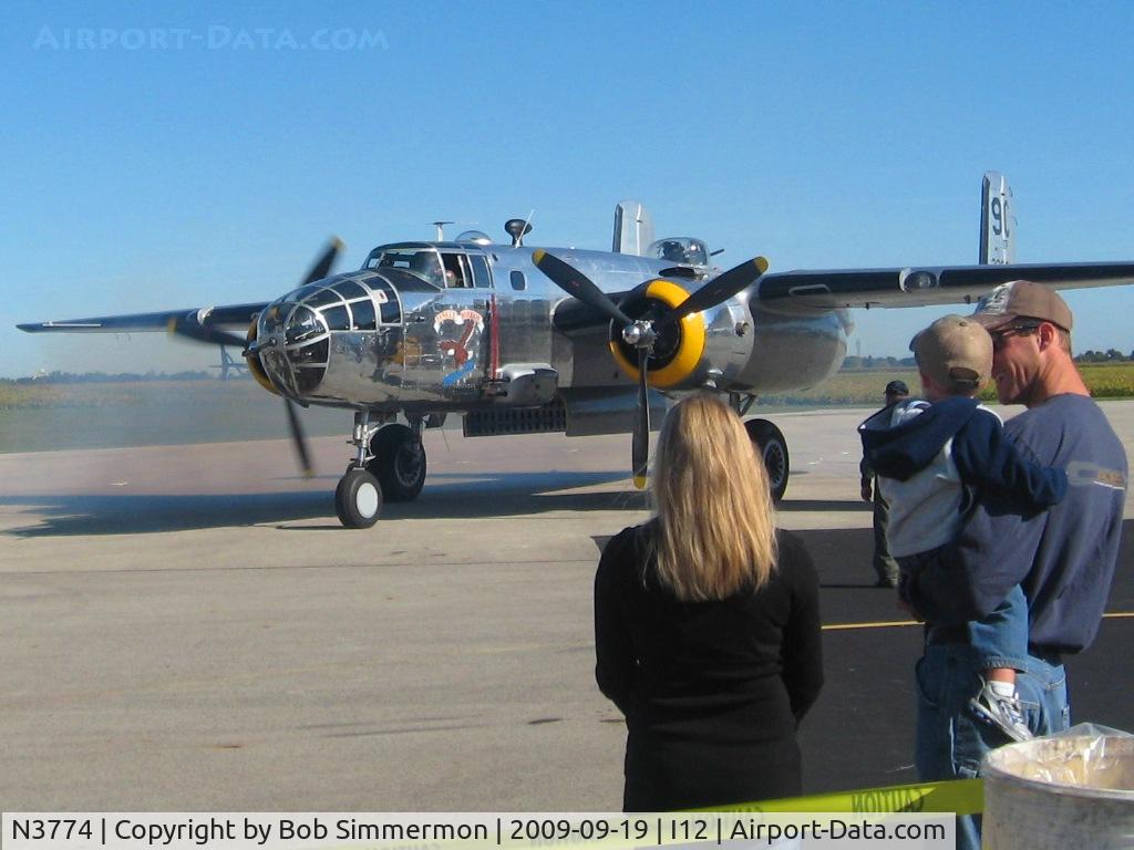 N3774, 1943 North American B-25D Mitchell C/N 100-23960, No. 2 meshed on the ramp at Sidney, Ohio during the EAA fly-in.