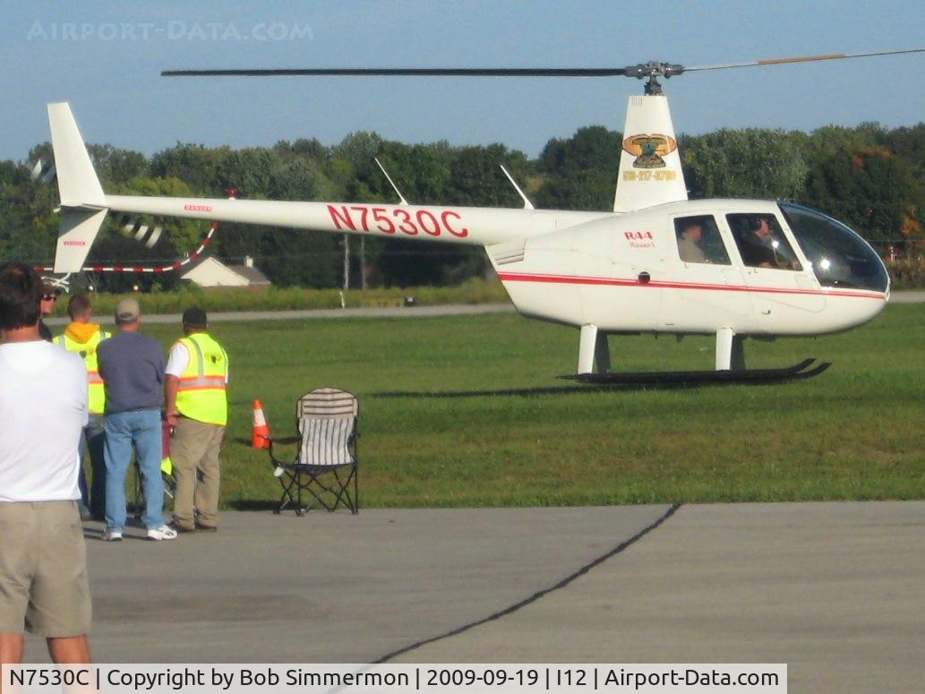 N7530C, 2004 Robinson R44 C/N 1398, Hauling rides during the EAA fly-in at Sidney, Ohio.