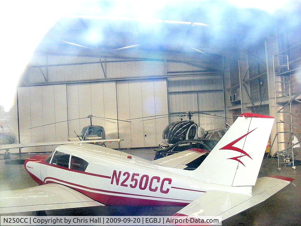 N250CC, 1960 Piper PA-24-250 Comanche C/N 24-1931, shot through the hanger window, hence the poor quality