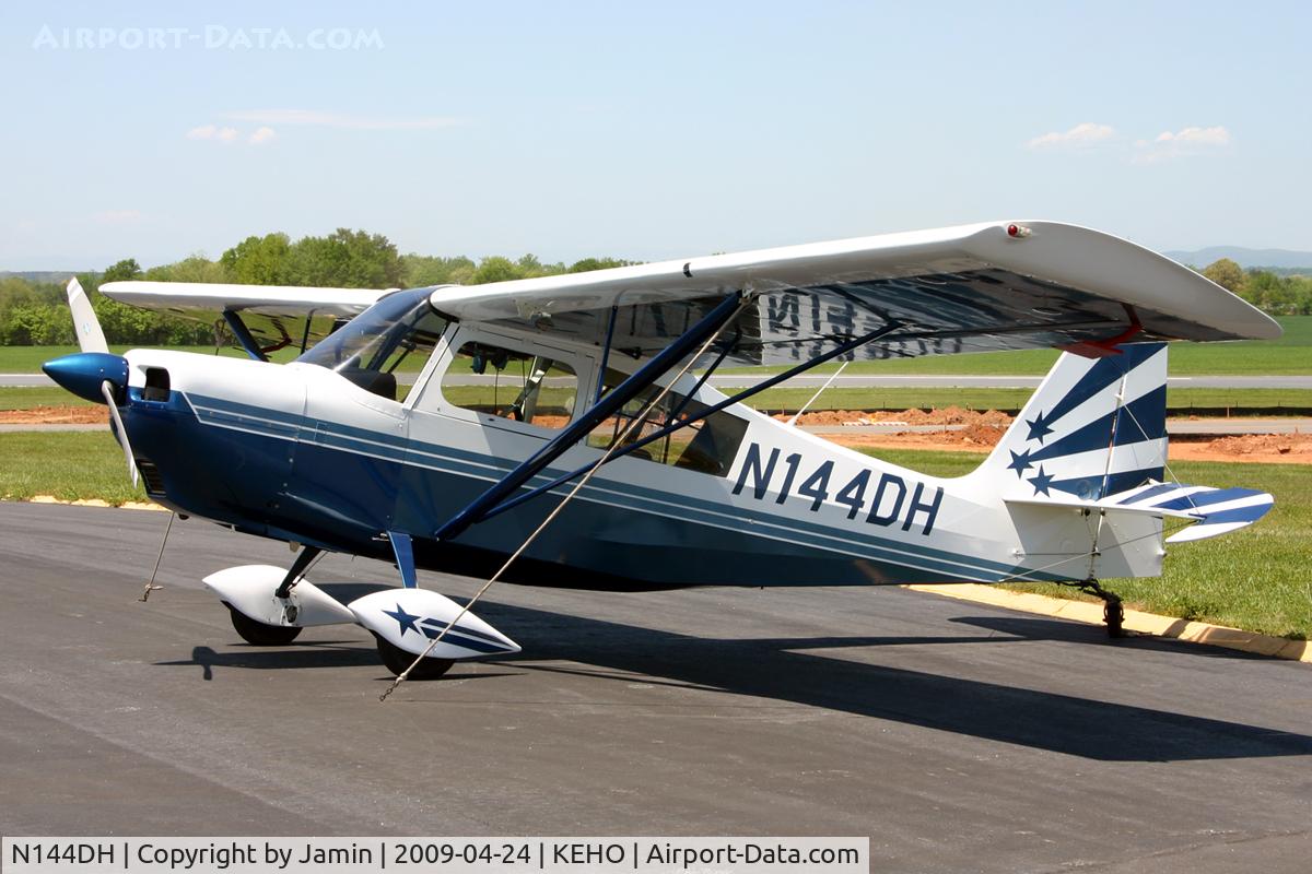 N144DH, 1996 American Champion 7GCBC C/N 1219-96, I really like the reflection of the fuselage on the underside of the wing.