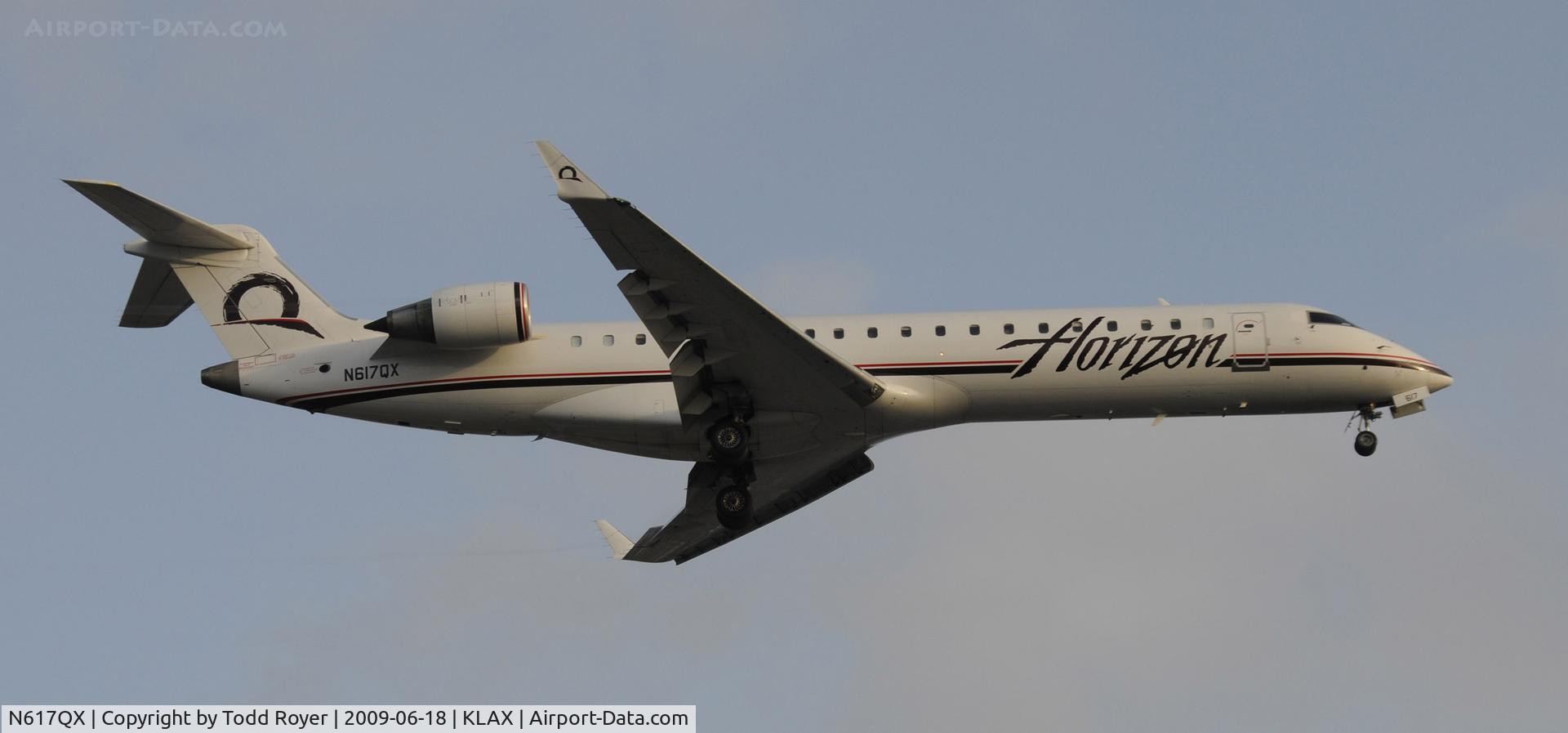 N617QX, 2003 Bombardier CRJ-701 (CL-600-2C10) Regional Jet C/N 10130, Landing 24R at LAX