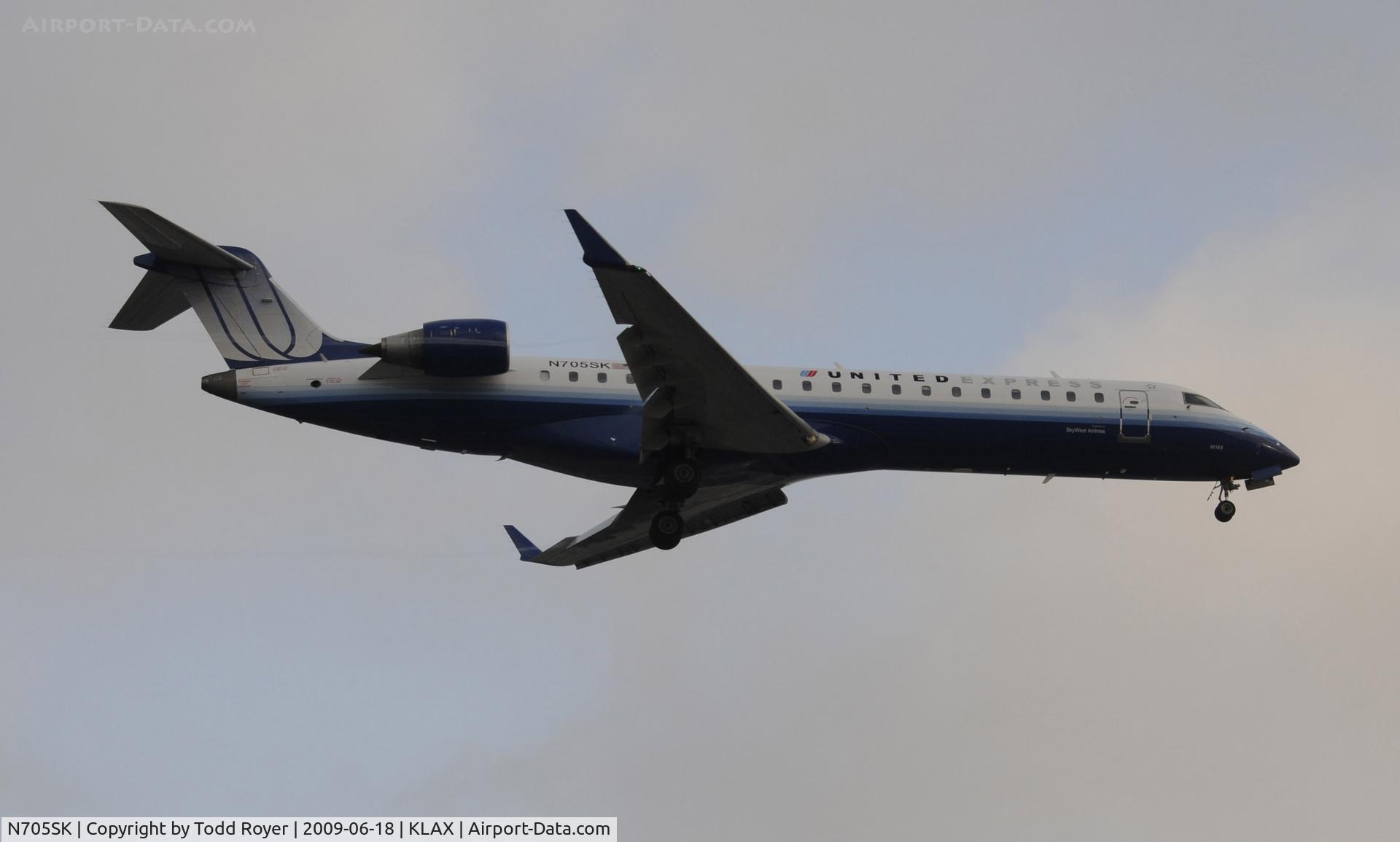 N705SK, 2004 Bombardier CRJ-701 (CL-600-2C10) Regional Jet C/N 10145, Landing 24R at LAX