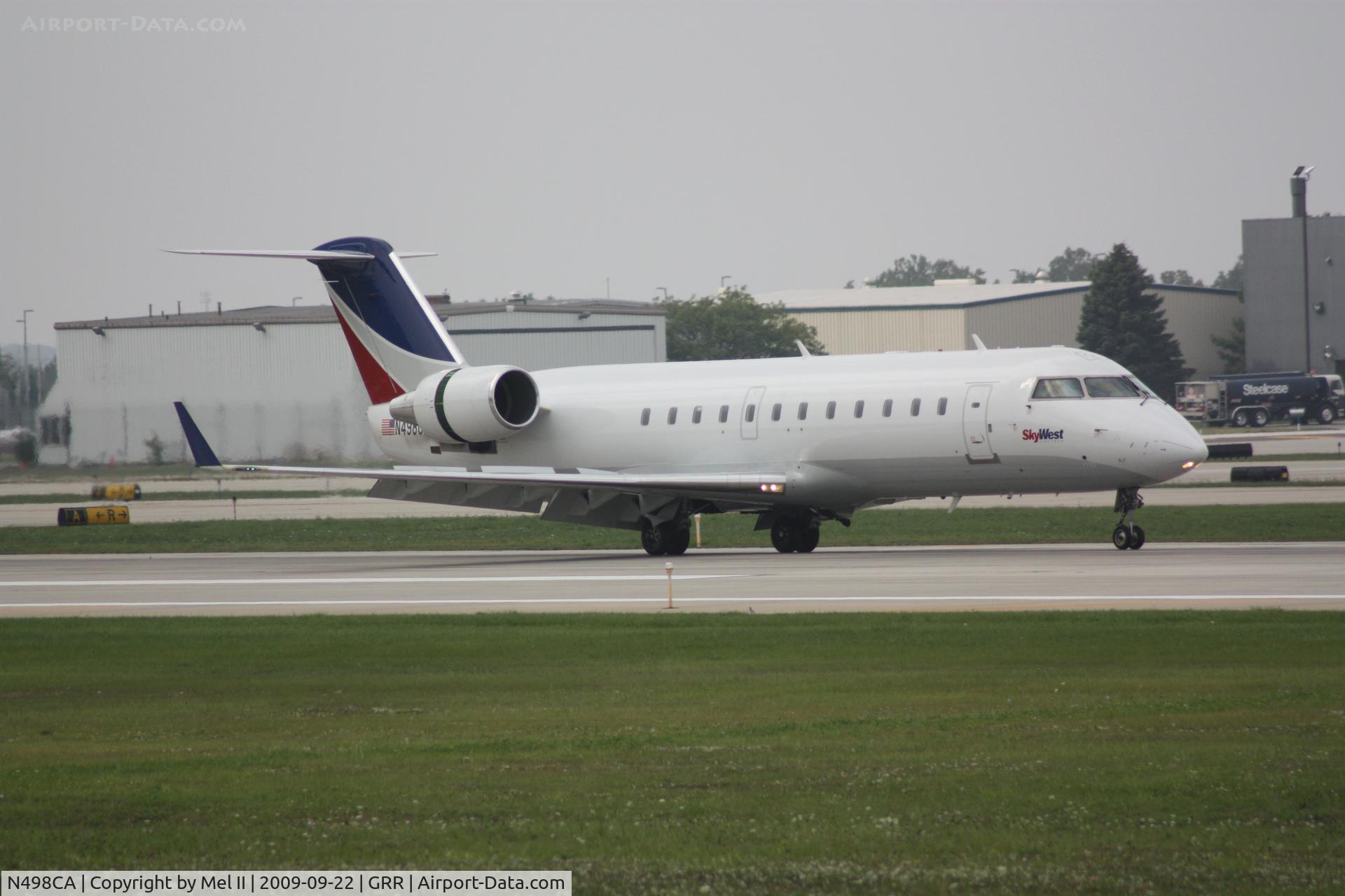 N498CA, 2003 Bombardier CRJ-200ER (CL-600-2B19) C/N 7792, SKW2516 - KMKE-KGRR - Landing RWY 8R