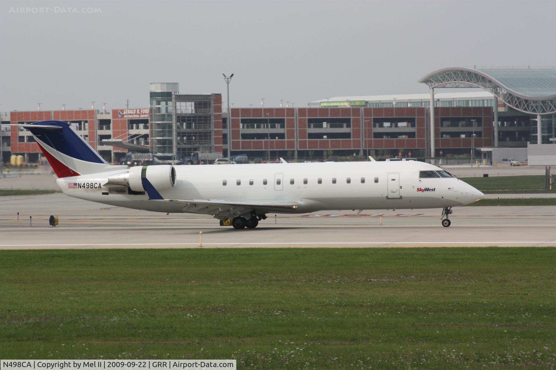 N498CA, 2003 Bombardier CRJ-200ER (CL-600-2B19) C/N 7792, SKW2516 - KMKE-KGRR - Landing RWY 8R