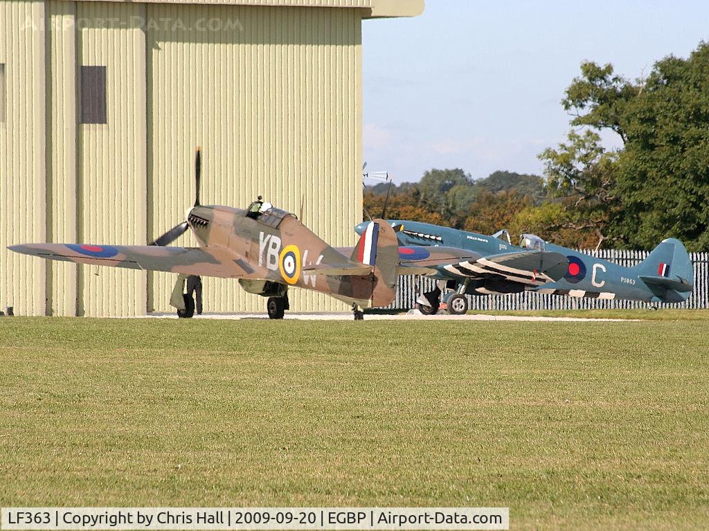 LF363, 1944 Hawker Hurricane IIC C/N 41H/469290, taxiing past G-RRGN Spitfire MK.XIX
