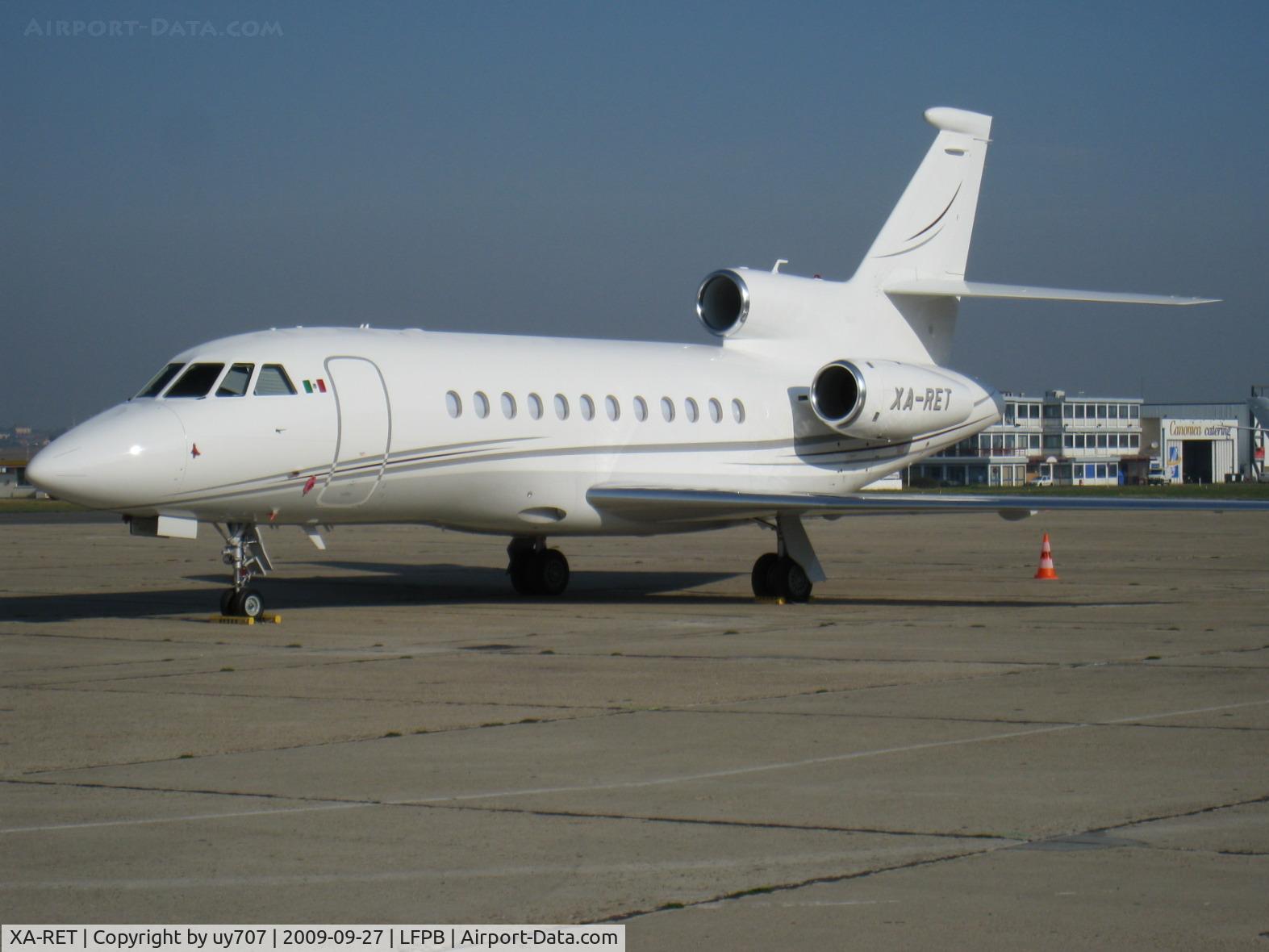 XA-RET, Dassault Falcon 2000 C/N 184, Falcon 900EX, c/n 203. Sitting on the business terminal's apron