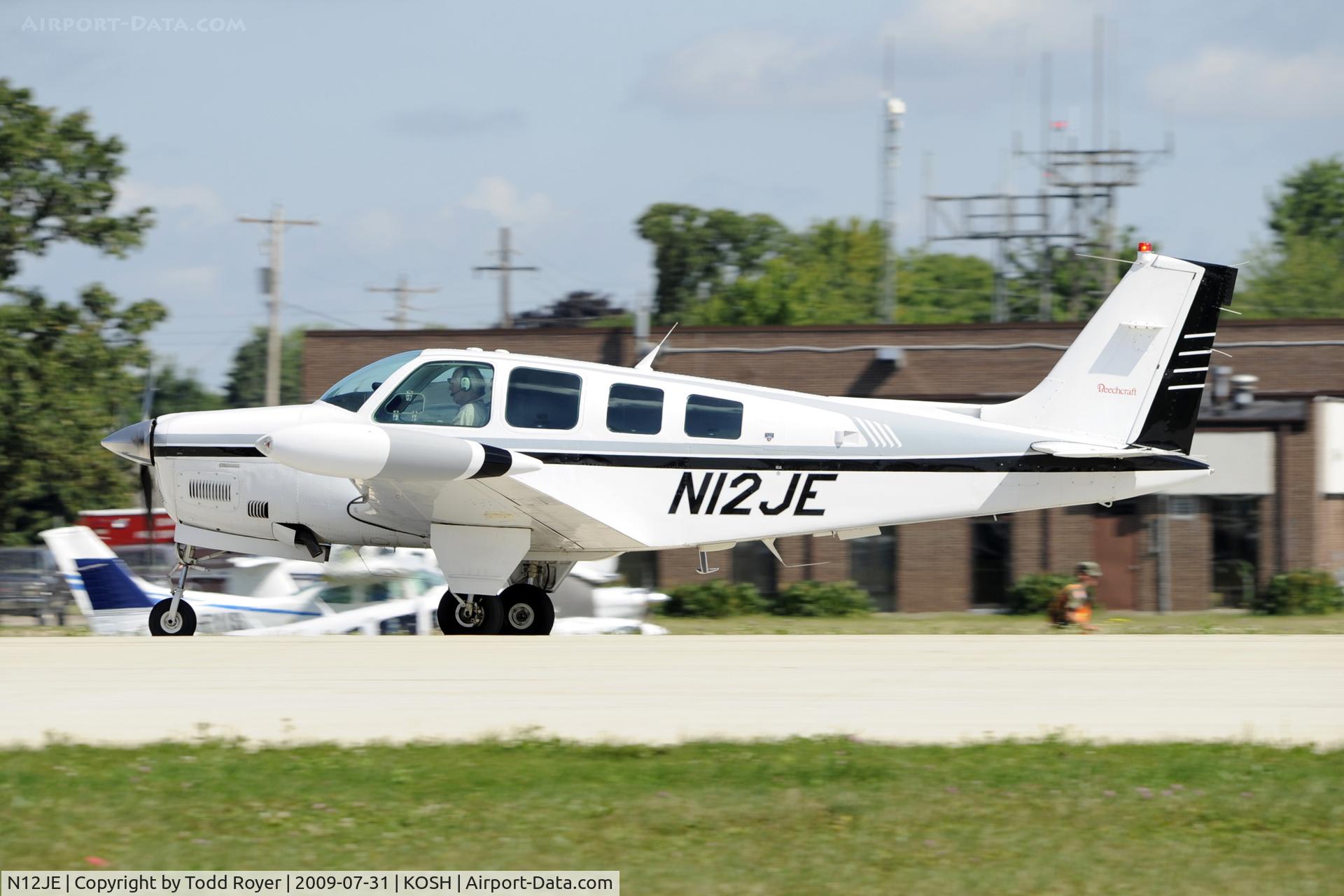 N12JE, Beech A36 Bonanza 36 C/N E-2961, Departing OSH on 27