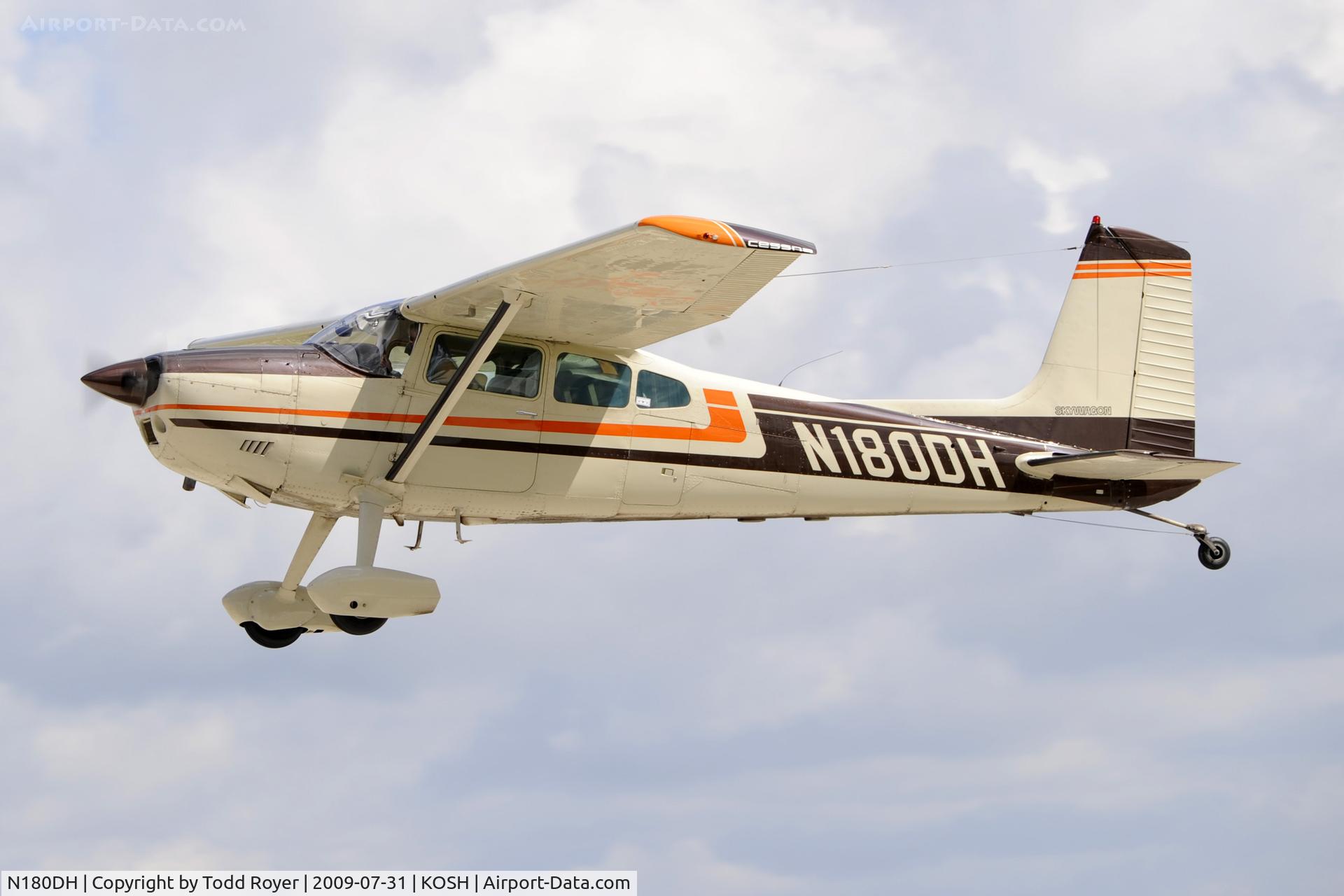 N180DH, 1975 Cessna 180J C/N 18052615, Departing OSH on 27