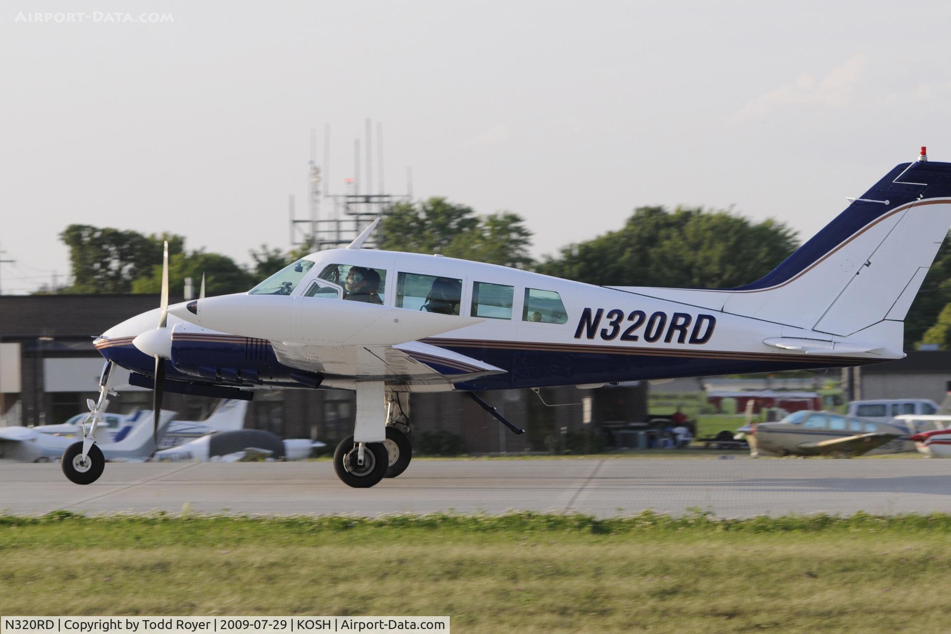 N320RD, 1963 Cessna 320B Skyknight C/N 320B0035, Departing OSH on 27