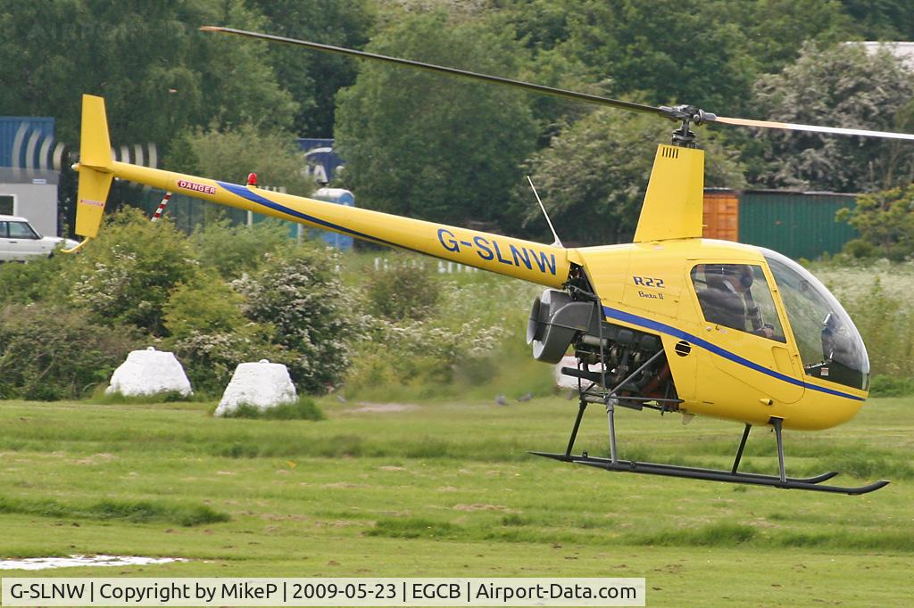 G-SLNW, 2003 Robinson R22 Beta II C/N 3524, Heading across the active.