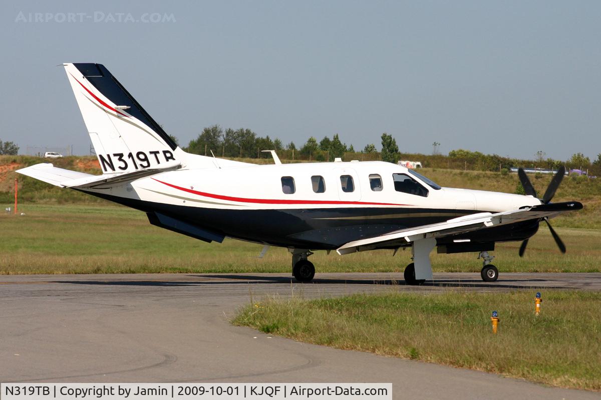 N319TB, 2005 Socata TBM-700 C/N 319, Holding short of runway 20 prior to departure.