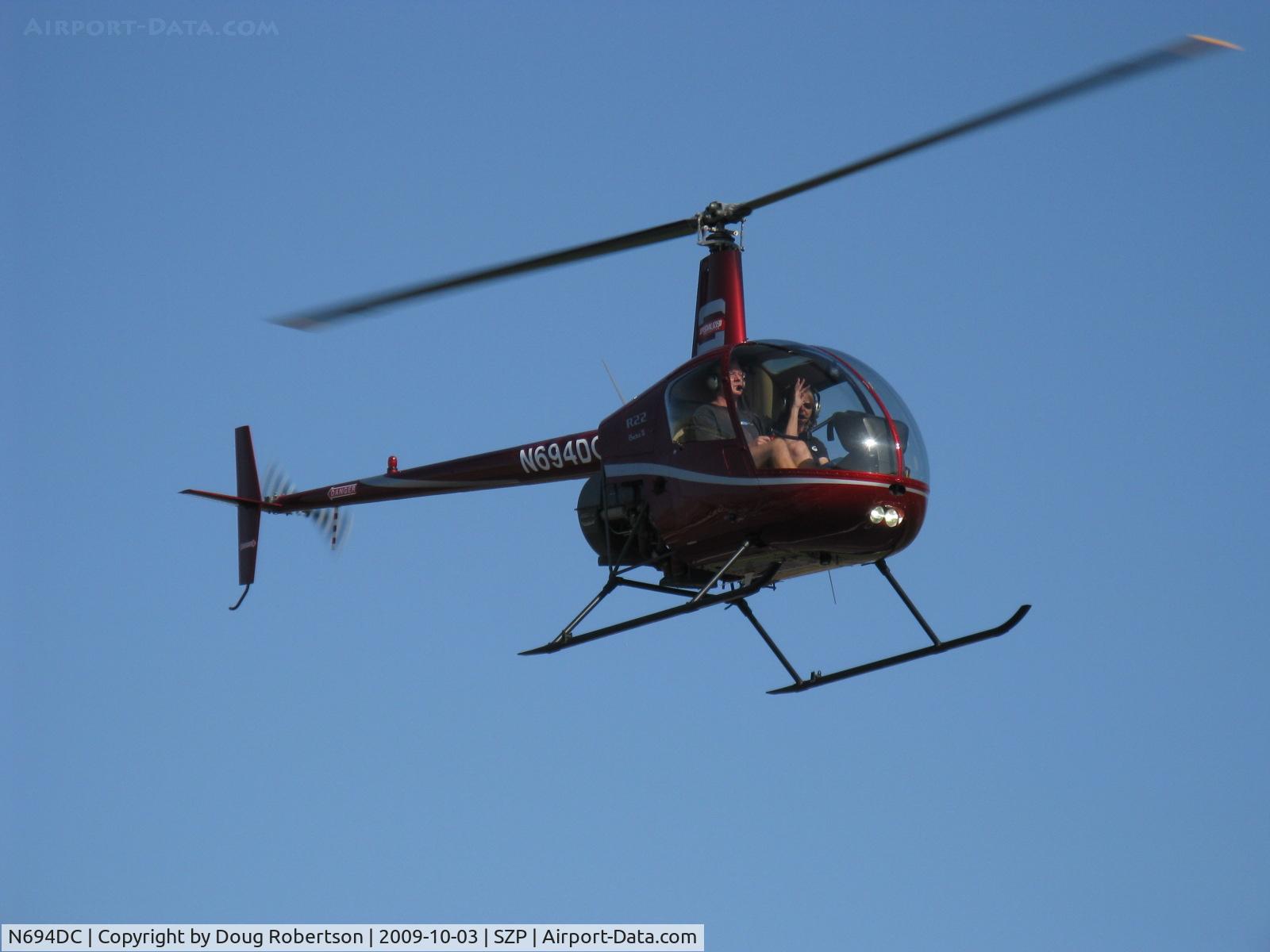 N694DC, 2004 Robinson R22 Beta C/N 3573, 2004 Robinson R22 BETA II, Lycoming O-360 derated to 131 Hp, approach Rwy 22 overflight, Hi Suzy!