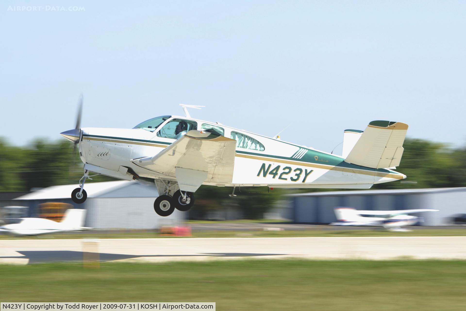 N423Y, 1961 Beech P35 Bonanza C/N D-6845, Departing OSH on 27