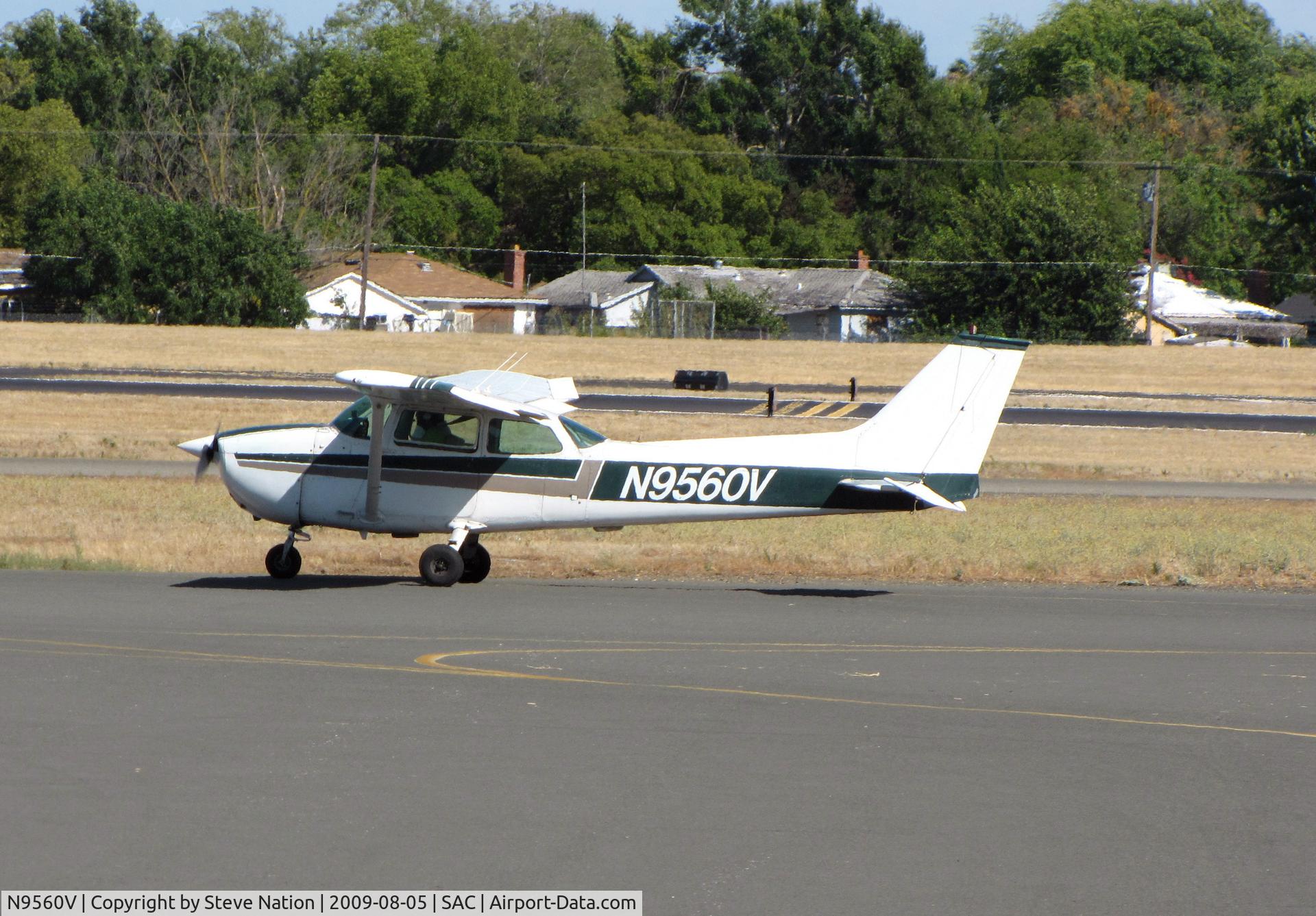 N9560V, 1974 Cessna 172M C/N 17264362, Locally-based 1974 Cessna 172M taxiing out for training flight on hot August afternoon